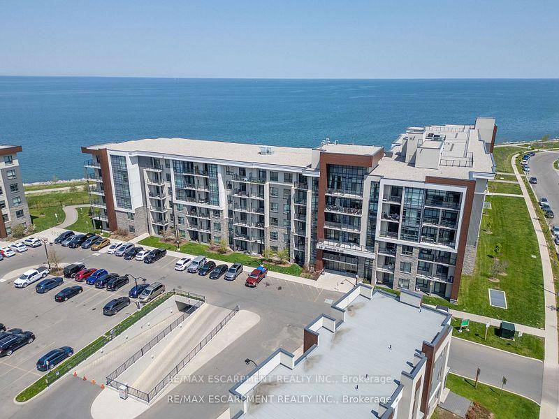 Experience lakeside living at its finest in this highly upgraded 1 bedroom den condo in Stoney Creeks desirable waterfront community.