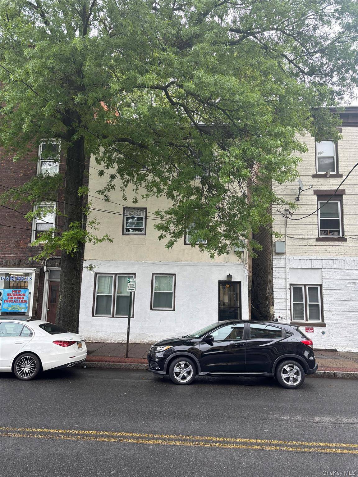 Investors, take note ! This three family property features three spacious one bedroom units, each equipped with its own gas boiler.