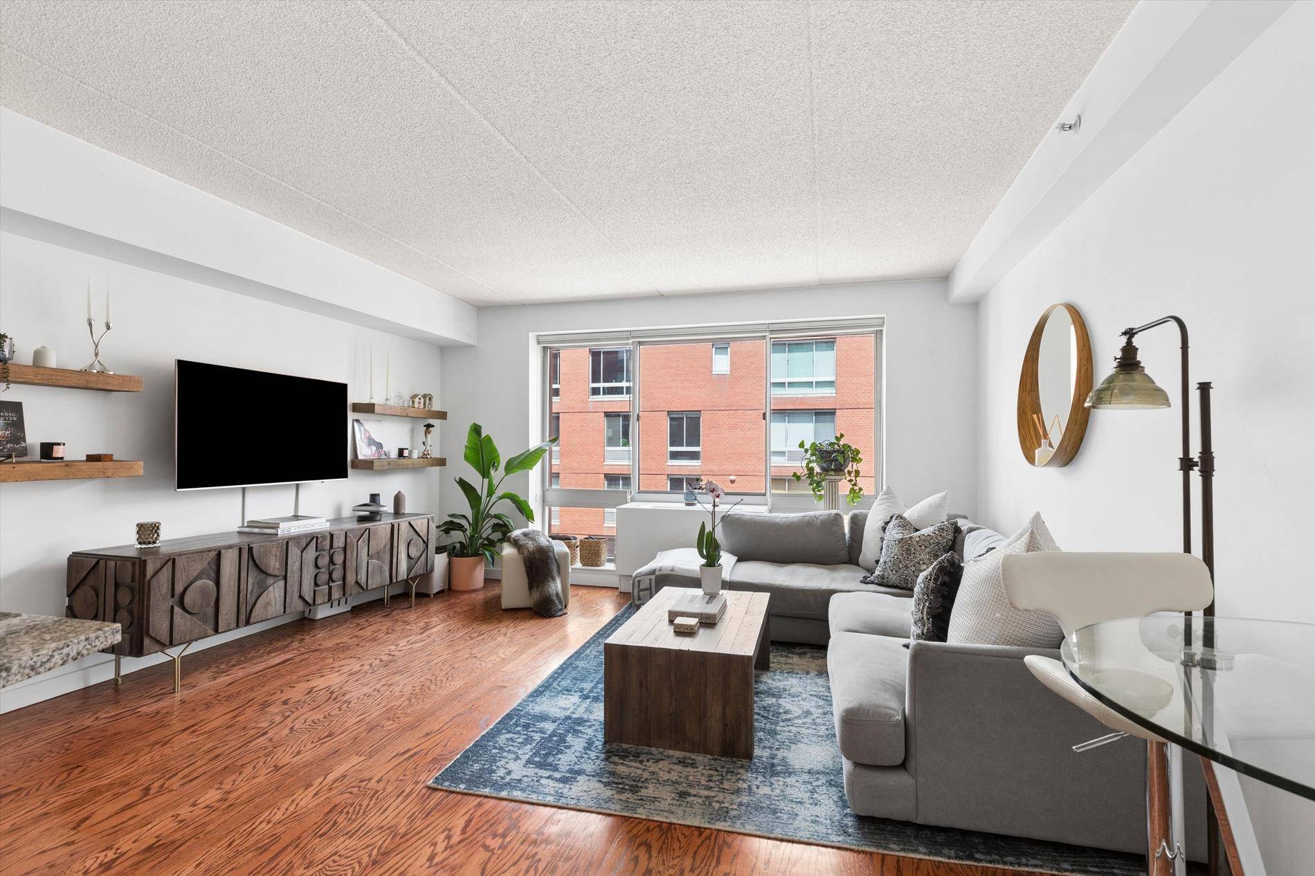 Experience elevated Chelsea living in this HIGH FLOOR luxurious one bedroom, one bath condominium at the coveted 555 West 23rd Street.