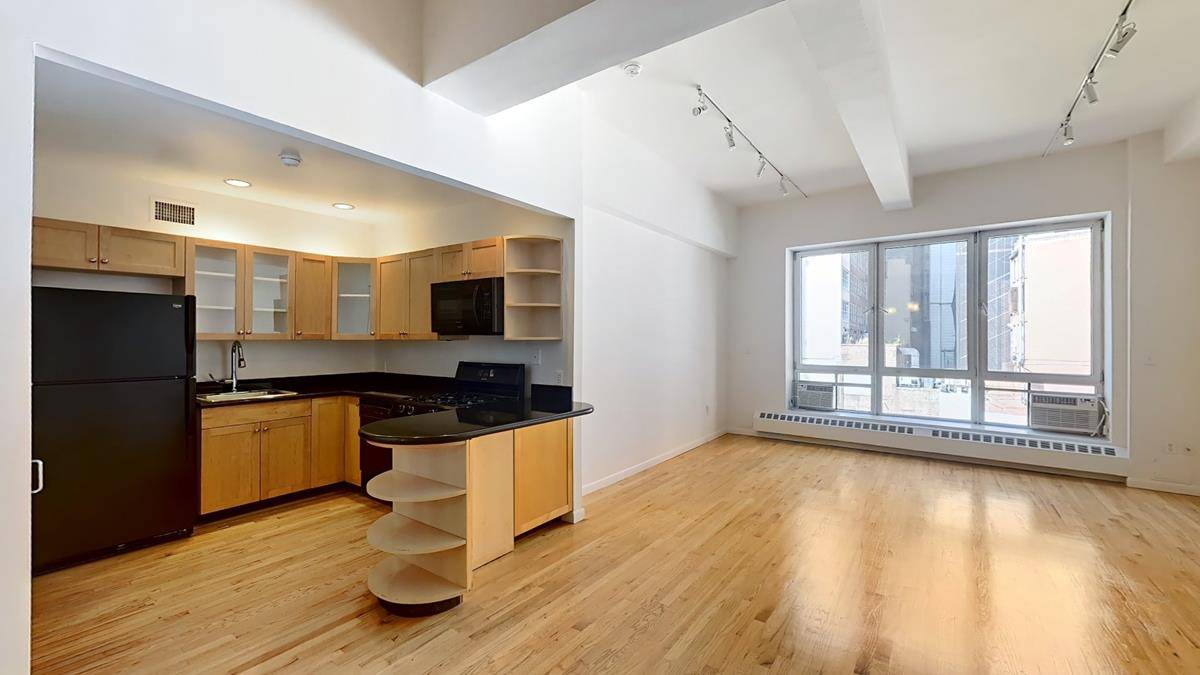 Large Live work studio loft in a low rise elevator building.