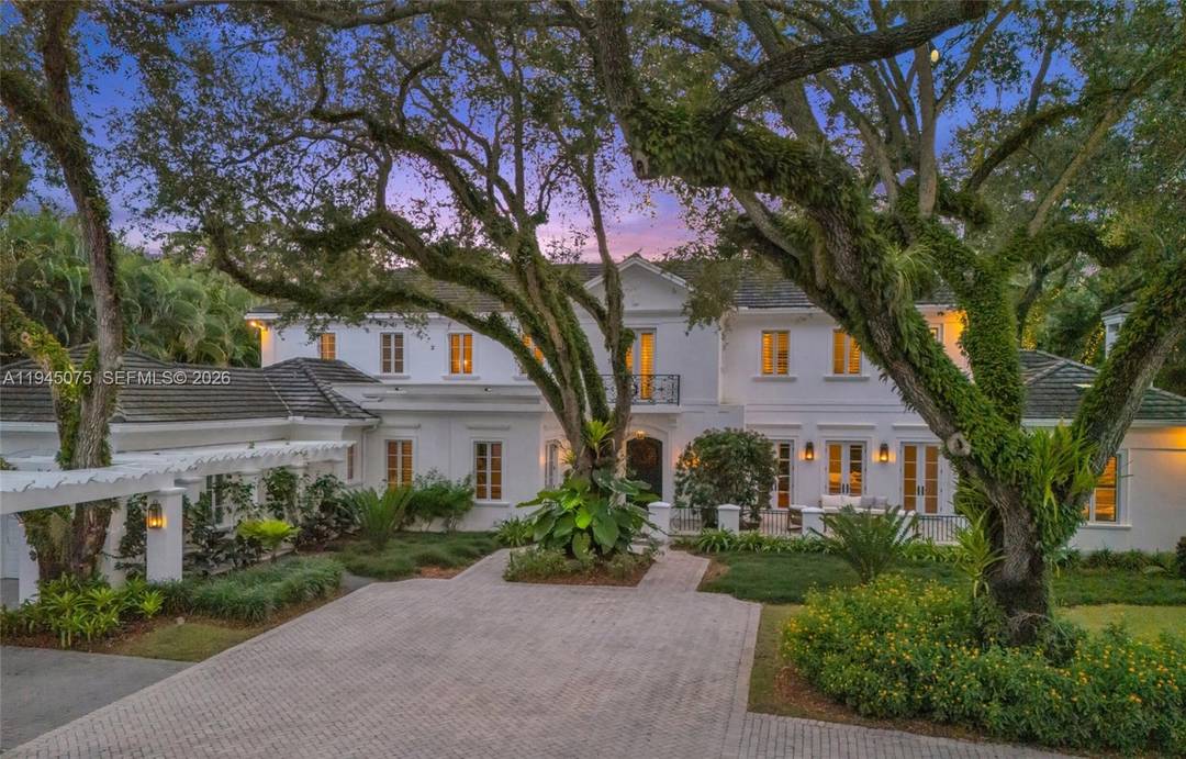 Anything but average. Set inside Stonegate, a private enclave of just 12 homes in Miami's Ponce Davis neighborhood, this French Provincial estate occupies a rare end position on a 32, ...