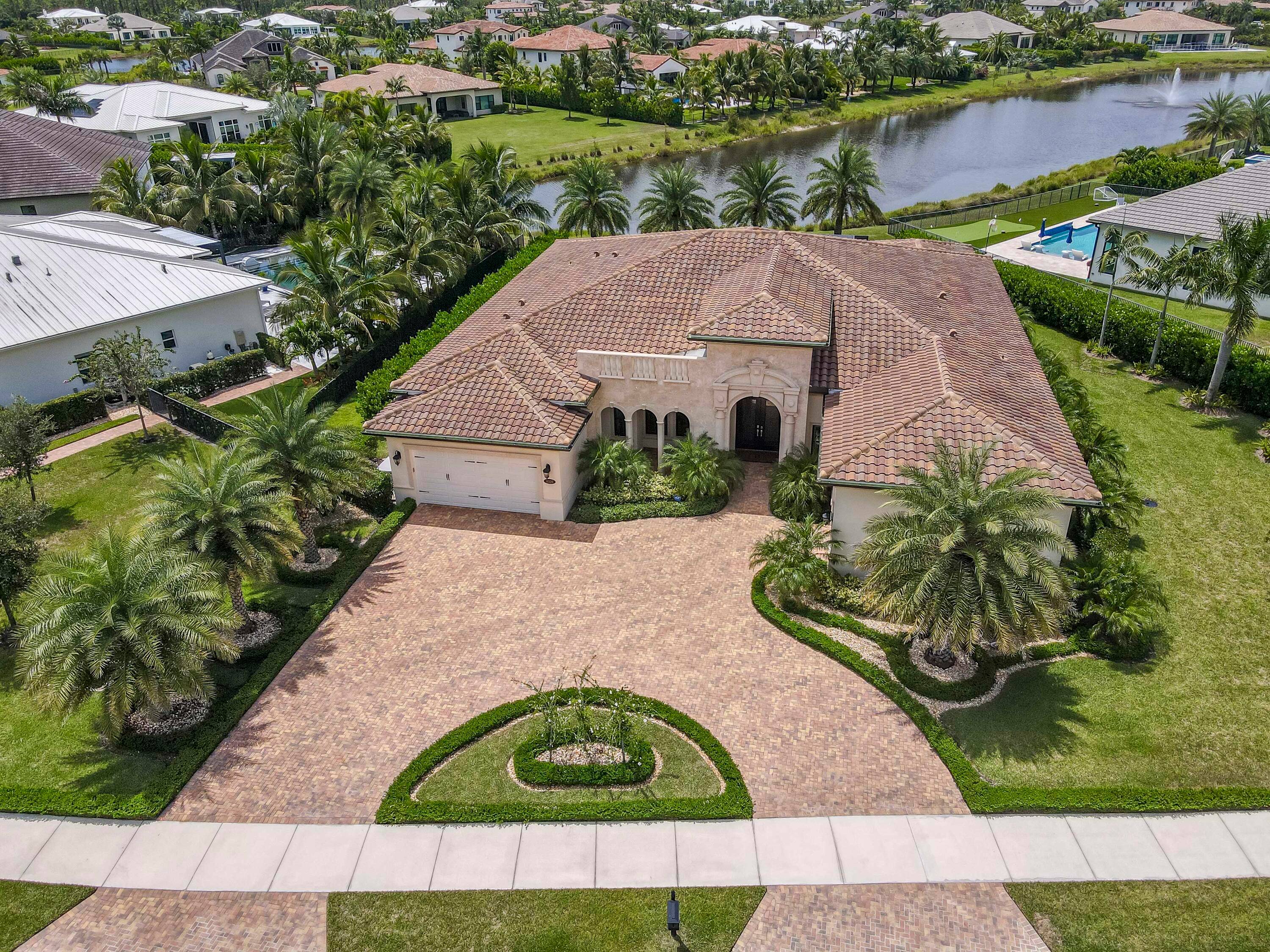 EXQUISITELY APPOINTED one story Hampton model with breathtaking long lake views in the luxury gated community of Prado is now available !