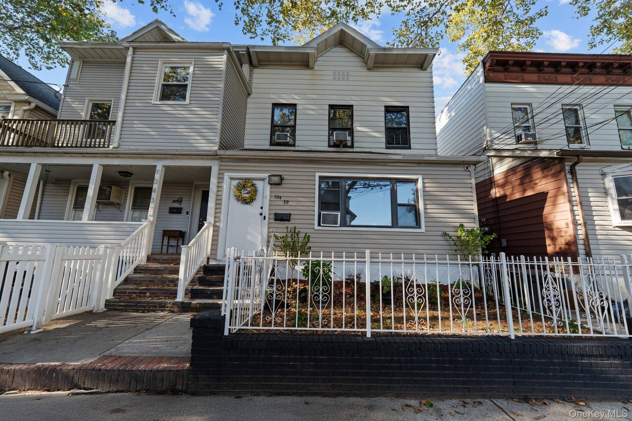Welcome to 104 39 90th Avenue, a beautifully maintained legal two family home located in the heart of Richmond Hill, Queens.