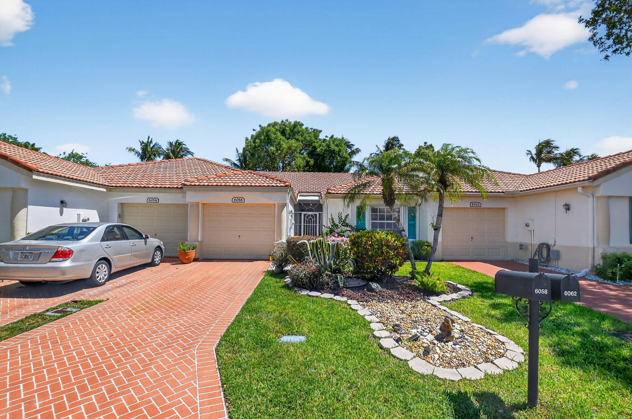 This beautifully maintained Iris model home is move in ready and features tile flooring throughout, including the enclosed Florida room patio.