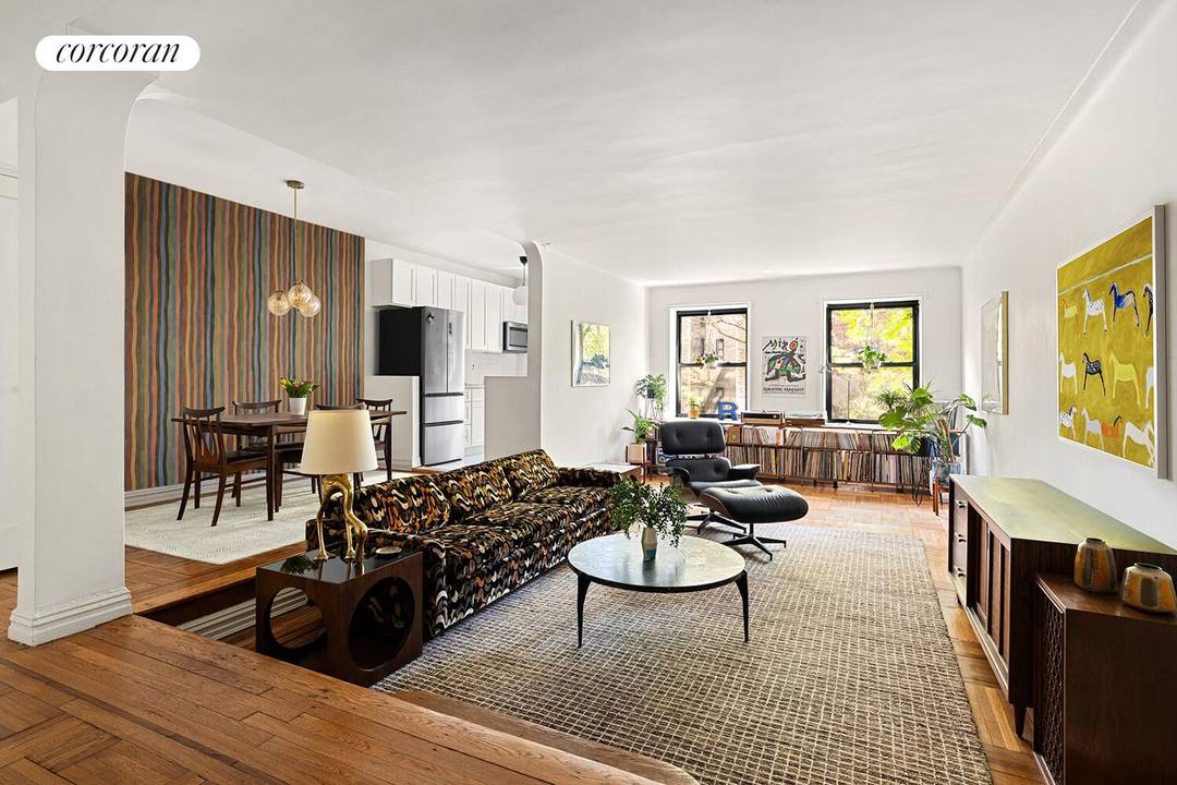A serene elevated first floor residence tucked quietly along the back of the building, offering a rare sense of calm and privacy just moments from the energy of the city.