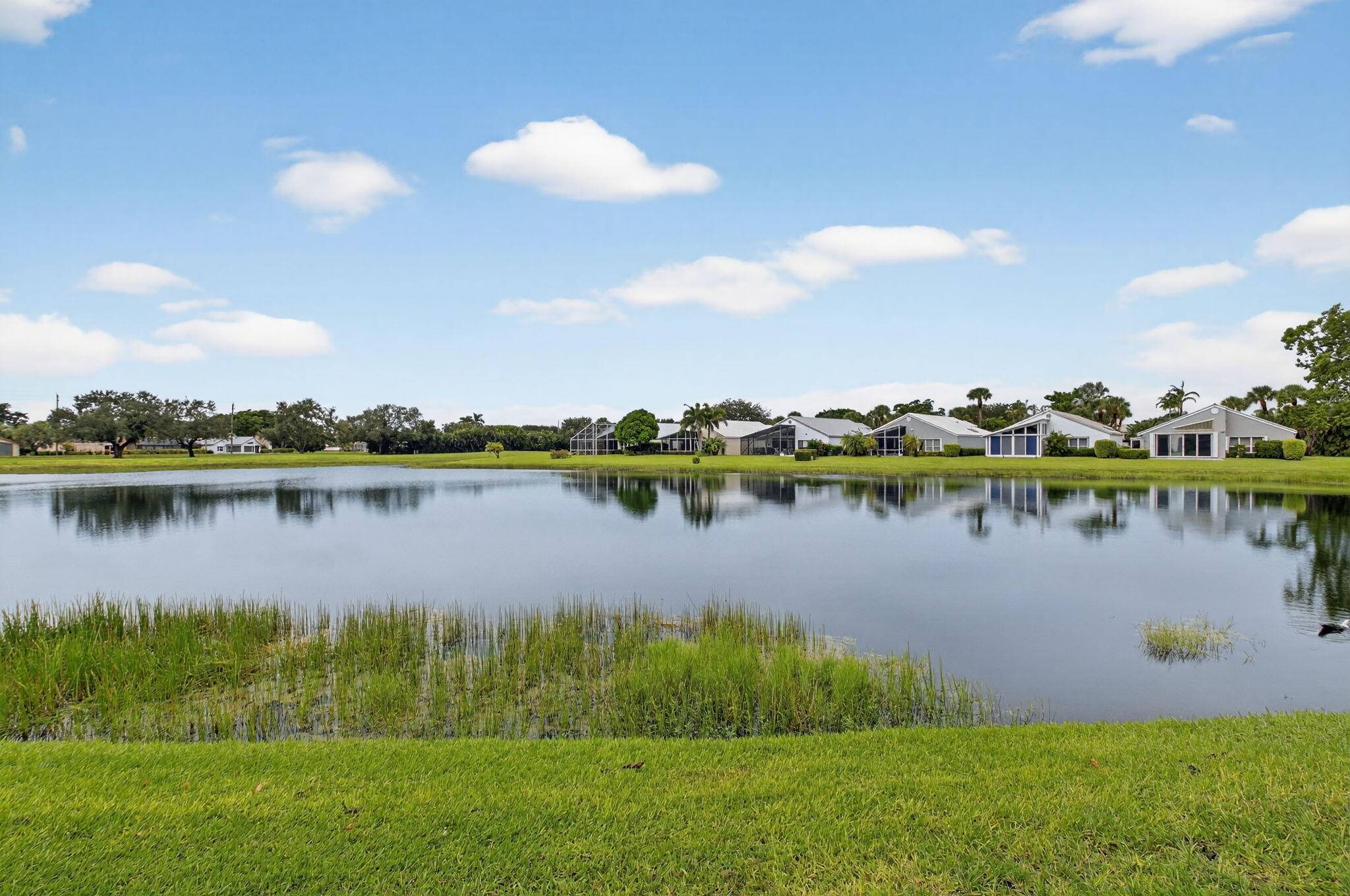 Views, views, views ! Enjoy lakeside living and golf course viewslocated in the Glades, an intimate 42 enclave of single family homesin Indian Springs.