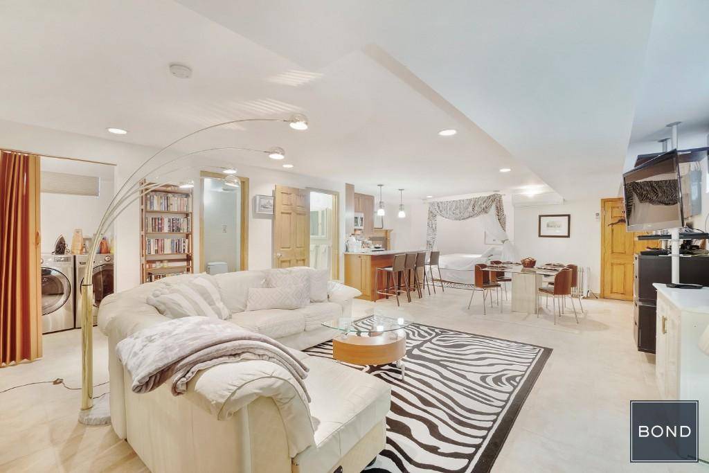 Experience the luxury of living in this meticulously constructed, brick home in the heart of Middle Village, Queens.