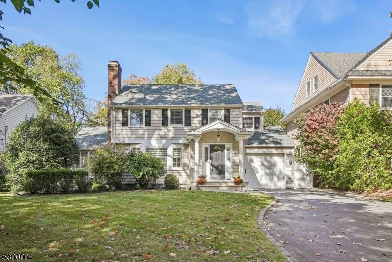 Set on a picturesque, tree lined street in one of Summit's most desirable neighborhoods, this fabulous 4 bedroom, 2.