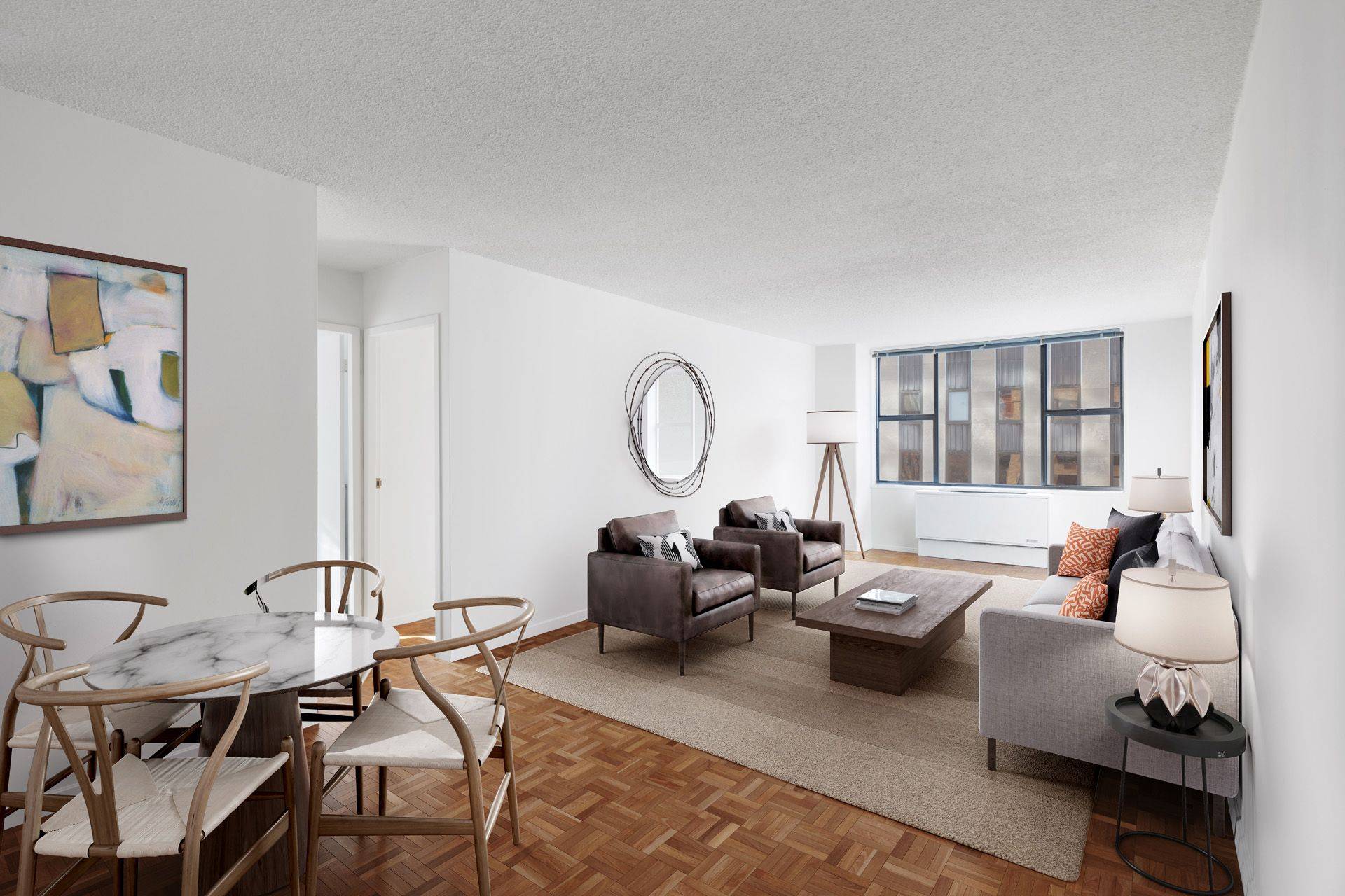 Spacious and bright one bedroom with a fully equipped kitchen, large living room with space for a dedicated dining area or home office, a bath, and wood floors throughout.