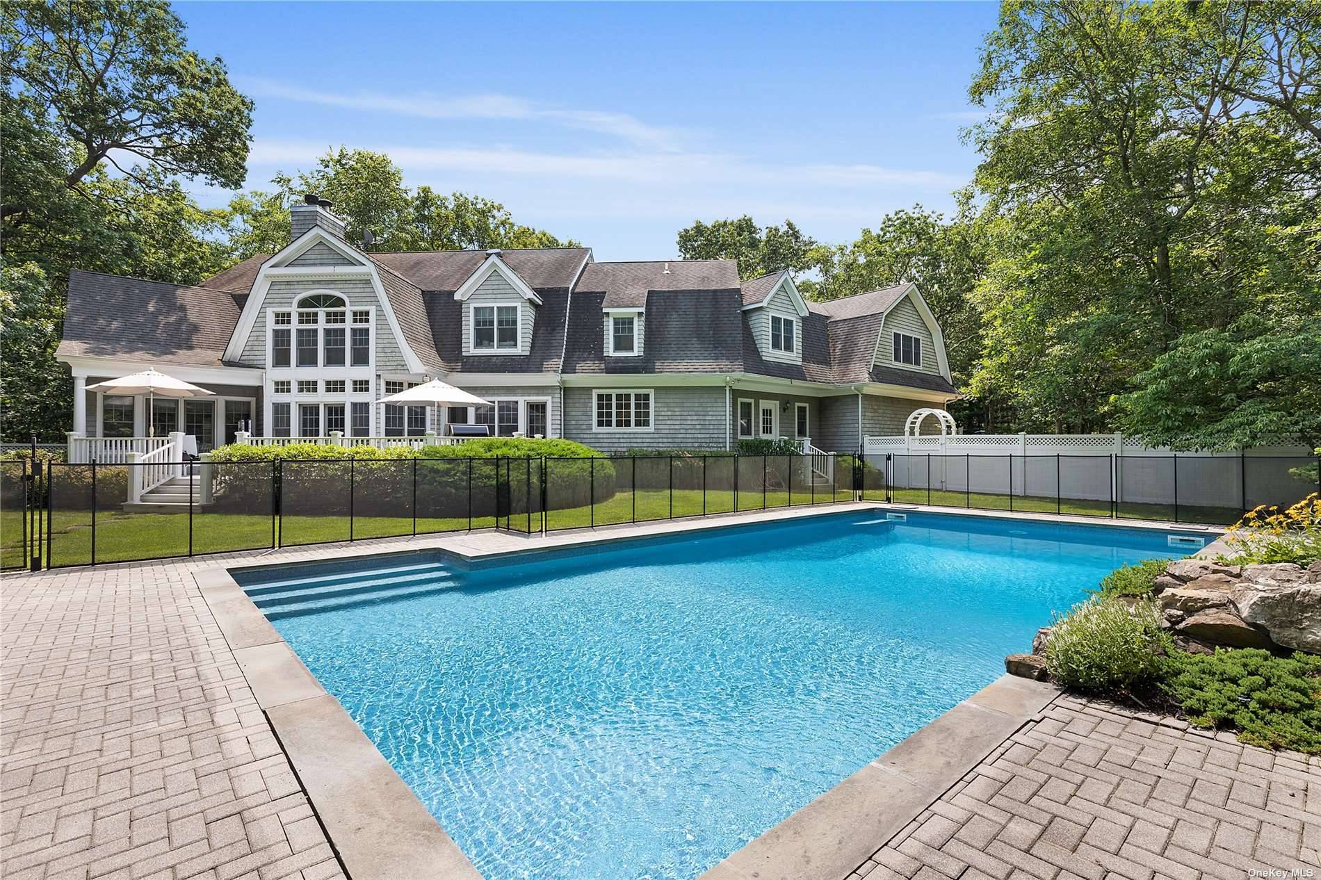 This stately residence sited on nearly two acres at the end of a quiet cul de sac offers 4, 500 sf.