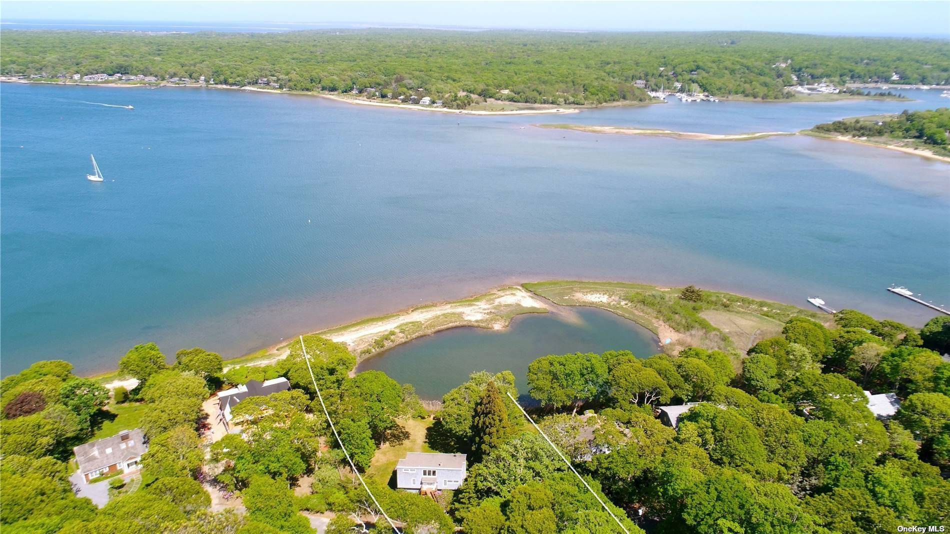 Turn key Waterfront getaway tucked away in a cul de sac in this private Artists Colony of luxury waterfront homes.