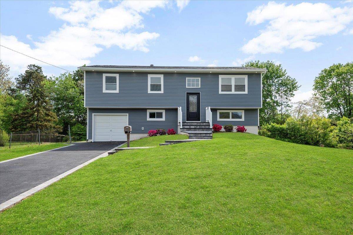 Welcome to this impeccably renovated home located in the heart of Dix Hills, offering the perfect blend of modern comfort and timeless appeal.
