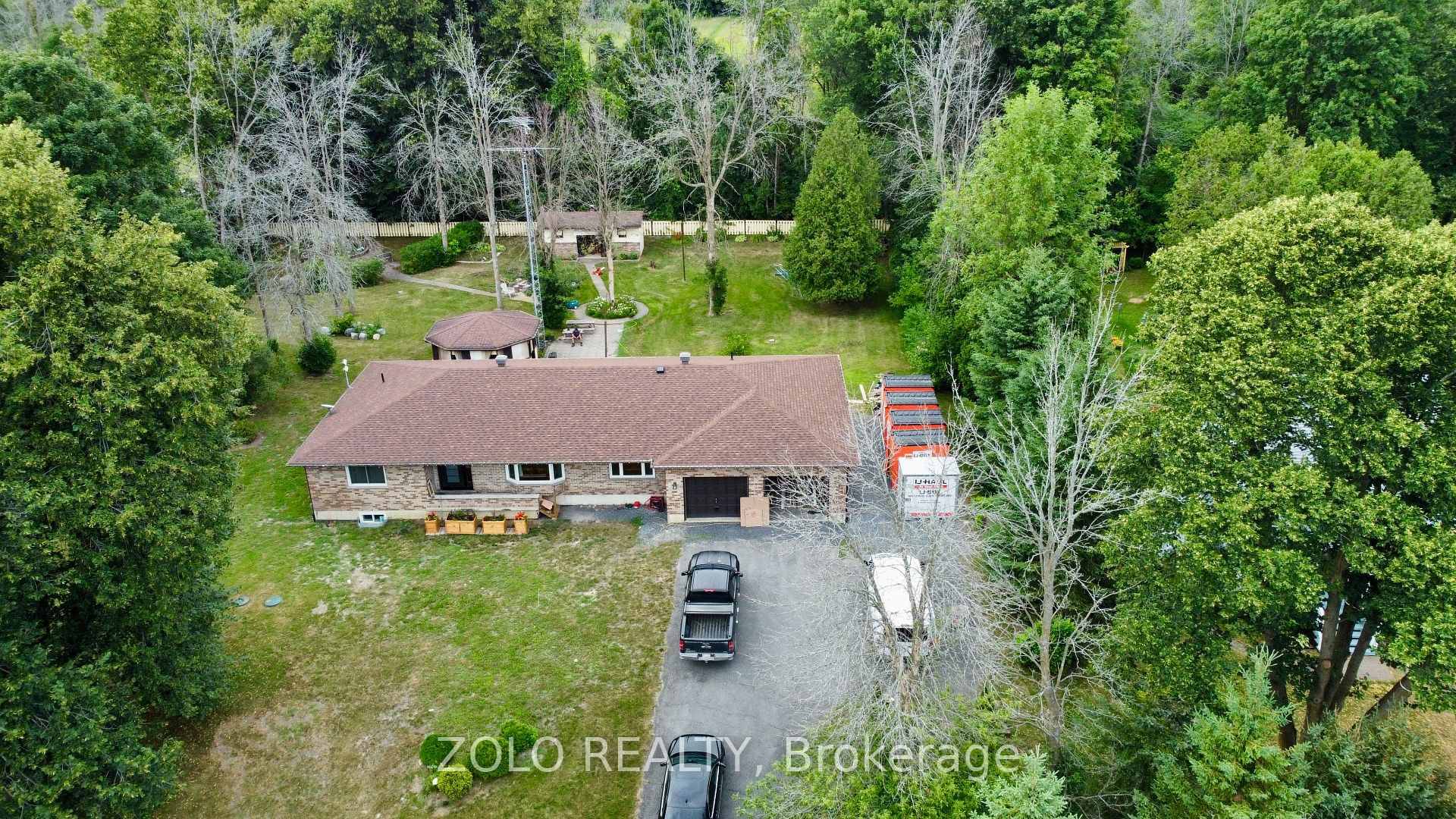 Welcome to 20411 Concession Road 5 in peaceful Green Valley a move in ready all brick bungalow offering 3 bedrooms, 2 baths, and approx.