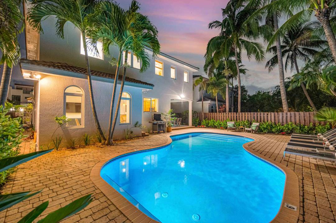Nestled between Fort Lauderdale Beach and Hugh Taylor Birch State Park, this spacious two story home captures the essence of year round beach living.