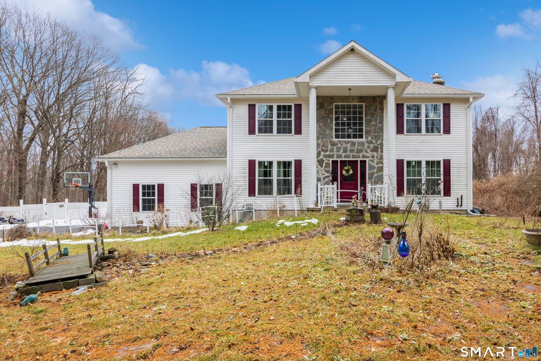 Set on nearly 3 private acres abutting the Bristol Water Company, this beautifully updated Colonial offers space, privacy, and over 300k in thoughtful upgrades.