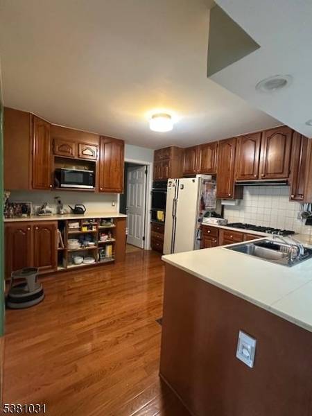 Large center hall colonial home with 5 bedrooms two on main level plus 4 full baths, plus extra large Recreation room in basement, two level deck, walk in Attic for ...