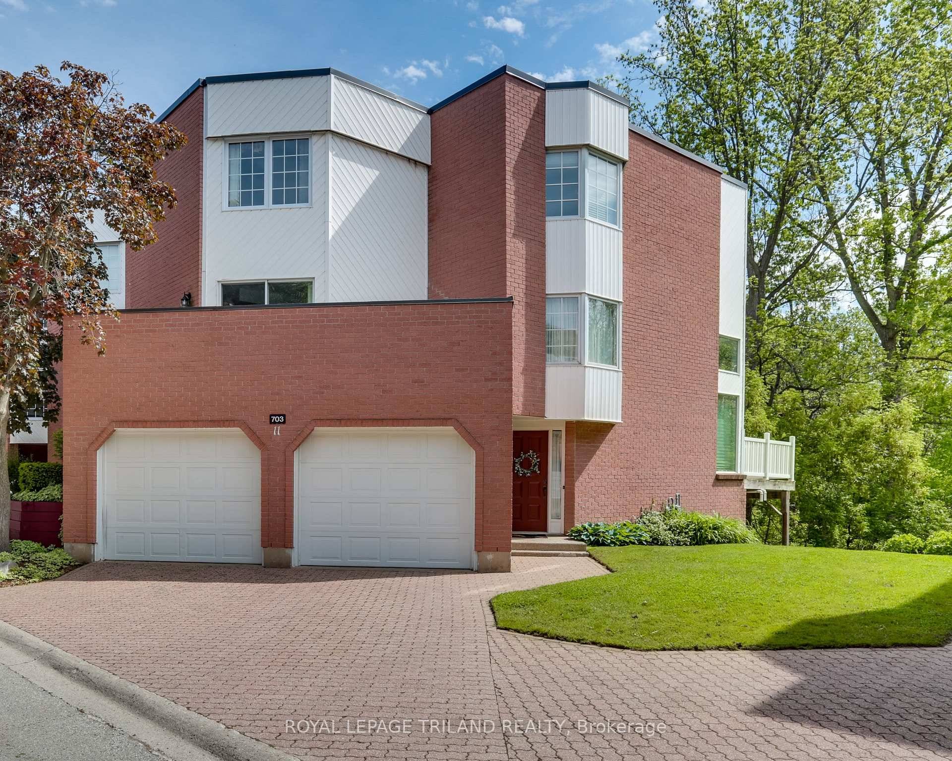 Luxurious End Unit Condo with Spectacular Green Views and Exceptional Design.