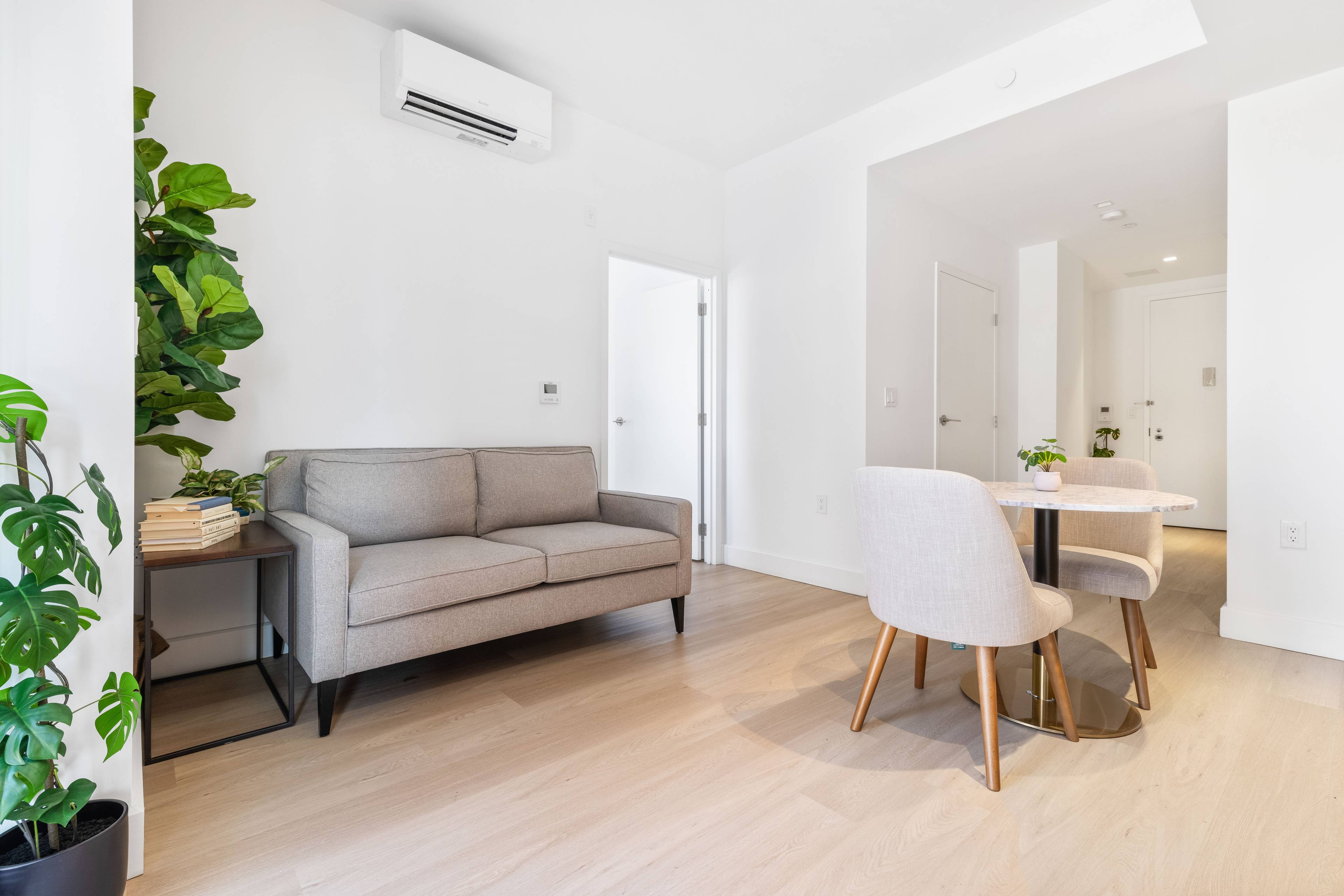Beautiful 1 bed 1 bath apartment ; large windows, counter island, matte black and Calcutta finishes, custom tiled bathrooms and in unit washer dryer.