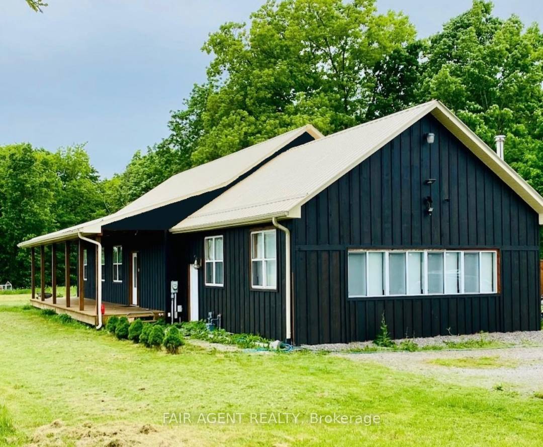 Experience the perfect blend of modern comfort and country living at 56091 Maple Grove Line in Bayham.