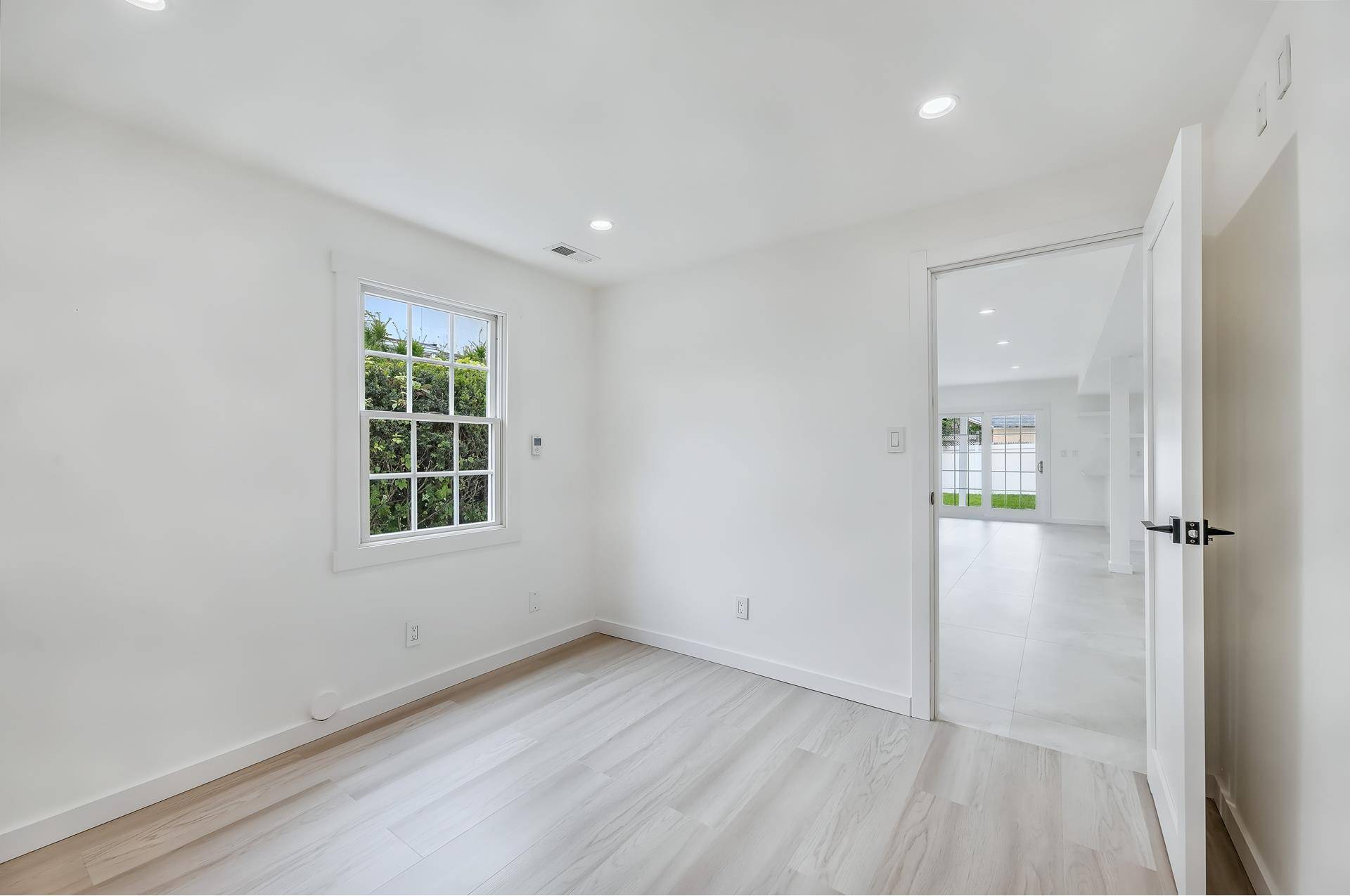 Welcome to a beautifully reimagined home in Brooklyn's exclusive, gated Seagate community.