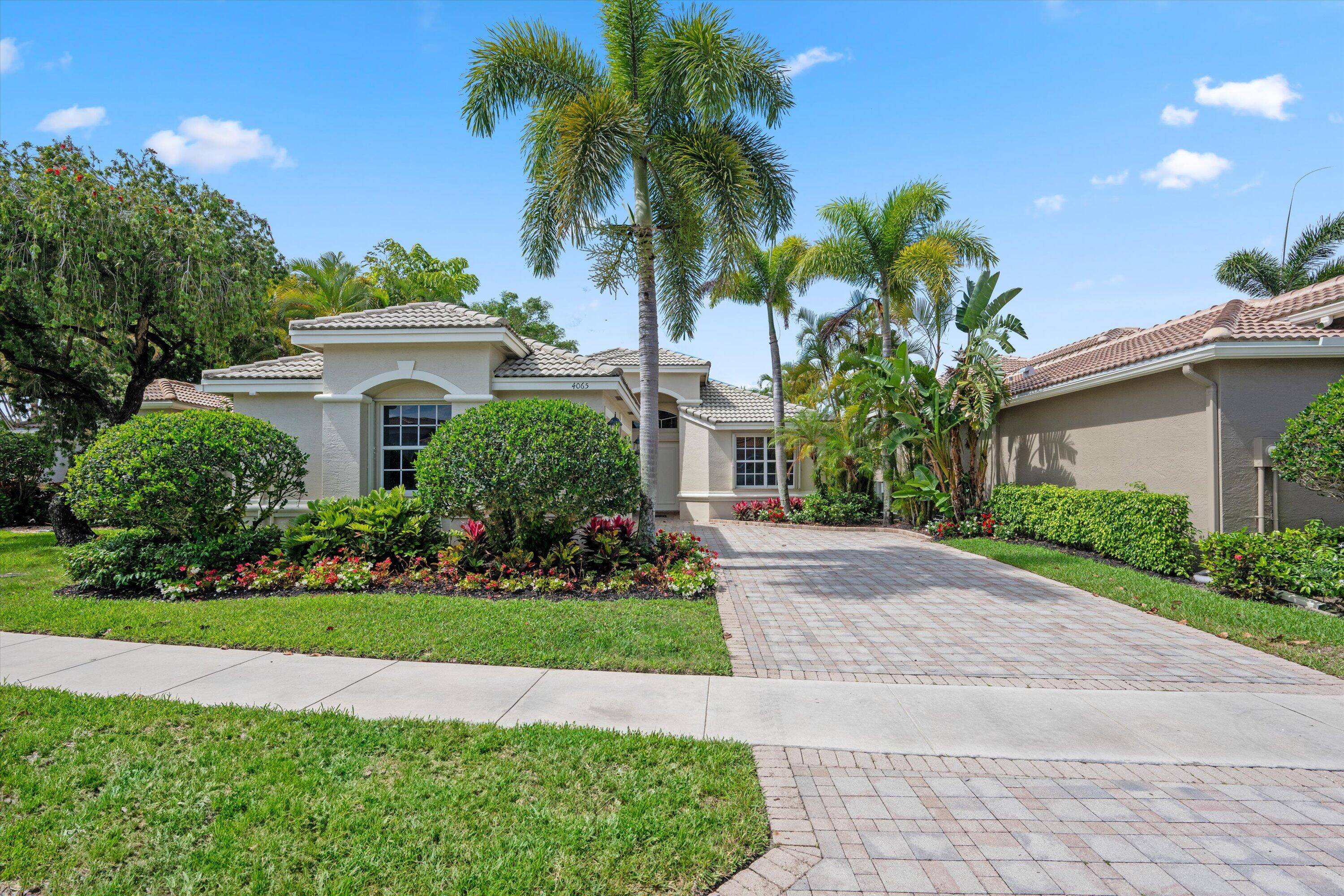 Welcome to 4065 Manchester Lakes Drive, a beautifully maintained 3 bedroom, 3 bathroom residence with 2, 588 sq ft of living space in Wycliffe Golf Country Club.
