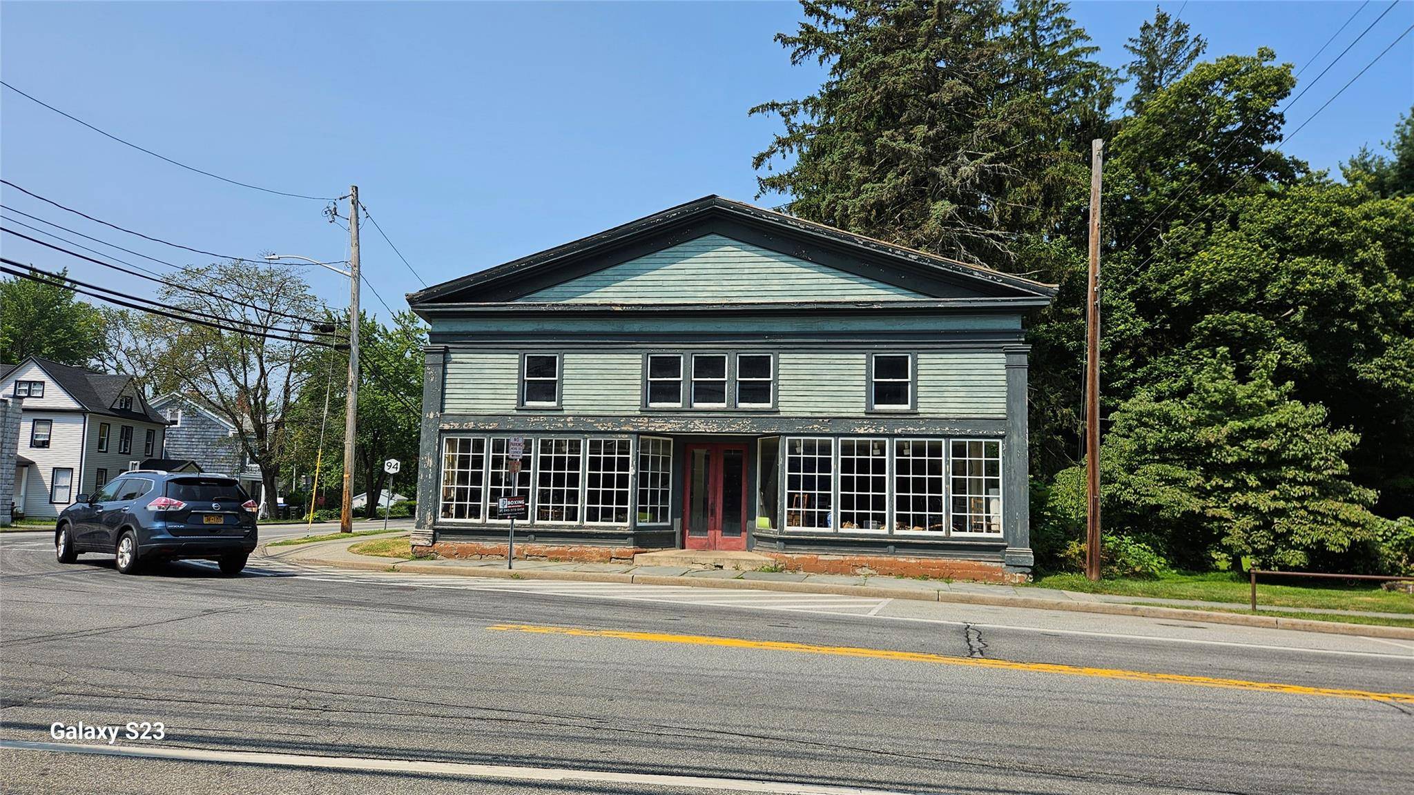 Discover a rare gem in the heart of Chester, NY, featuring a prime corner lot spanning approximately 1.