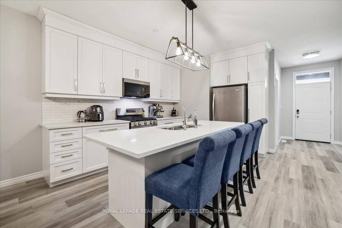 Welcome to 44 Main Street 6 in the desirable Innerkip Greens community a beautifully upgraded bungalow townhouse offering 1, 312 square feet of elegant, single level living.
