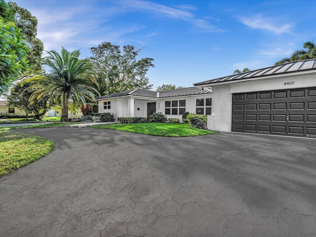 Beautifully updated and exceptionally rare 5BD 4BA residence on an elevated 14.