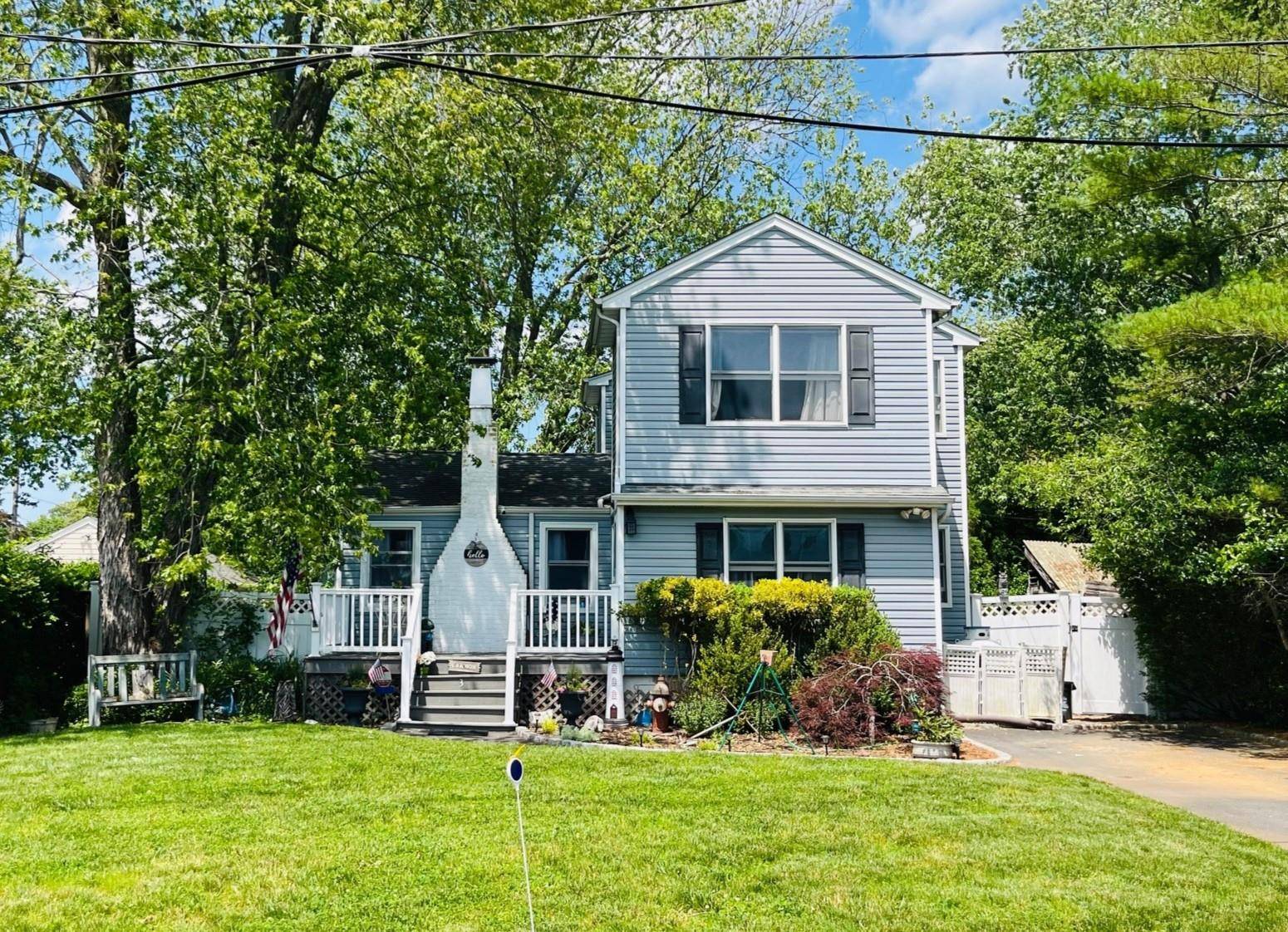 Discover this charming expanded ranch located in the highly sought after private beach community of Patchogue Shores.