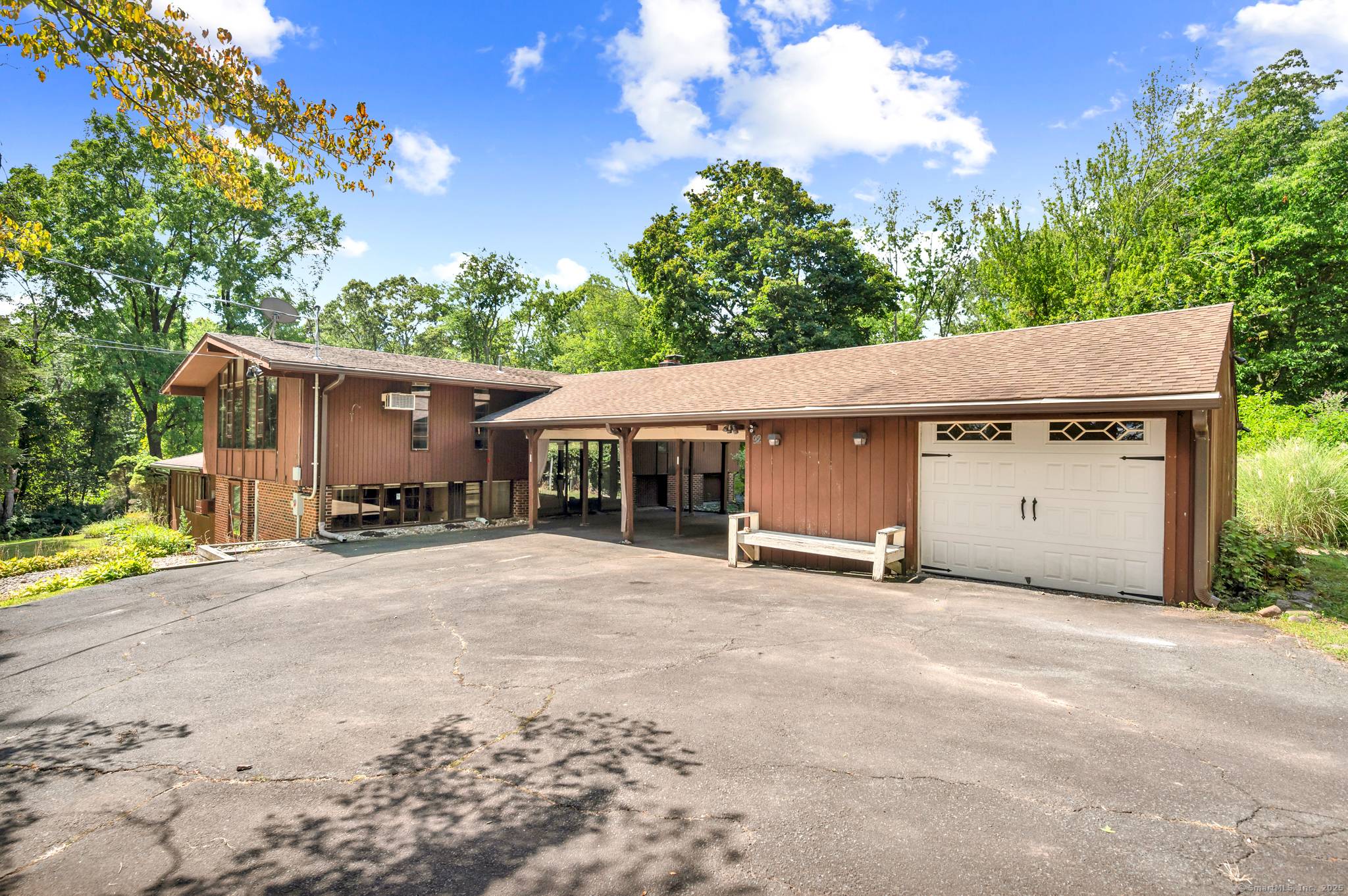 Welcome to this one of a kind contemporary raised ranch nestled on a private 1.