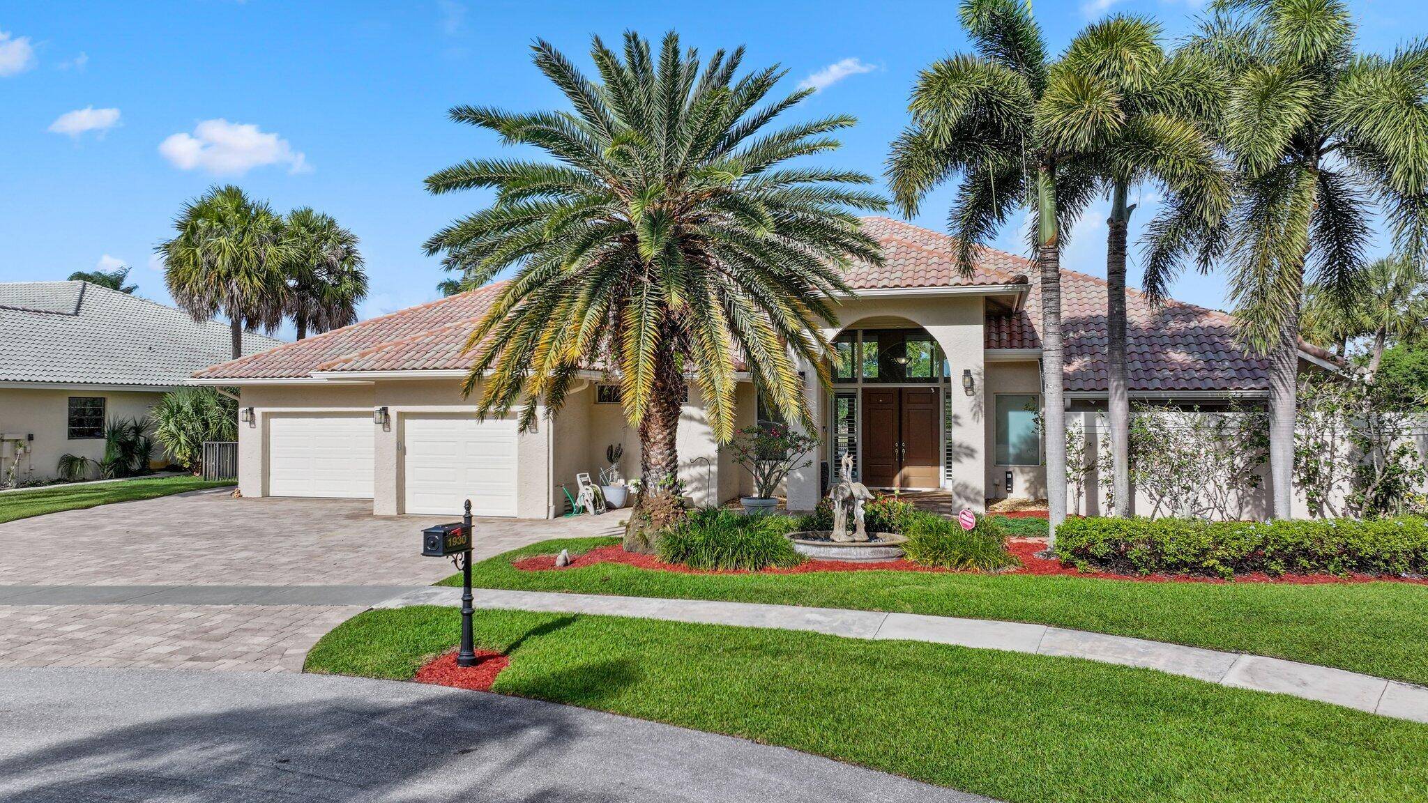 This elegant one story lakefront home in Boca Sailing Racquet boasts a spacious 3 way split floor plan with panoramic views of the 45 acre recreational lake.