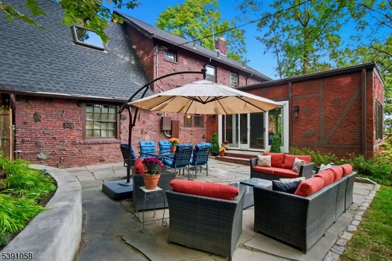 Welcome home to this 1930 english Tudor that blends architectural character with modern systems and designer finishes.