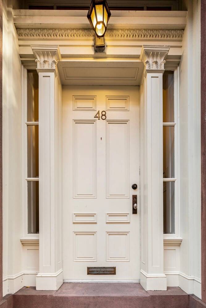 Exceptional and Wide Single Family Townhouse in the West Village Built in 1846, this sun filled grand scale 22.