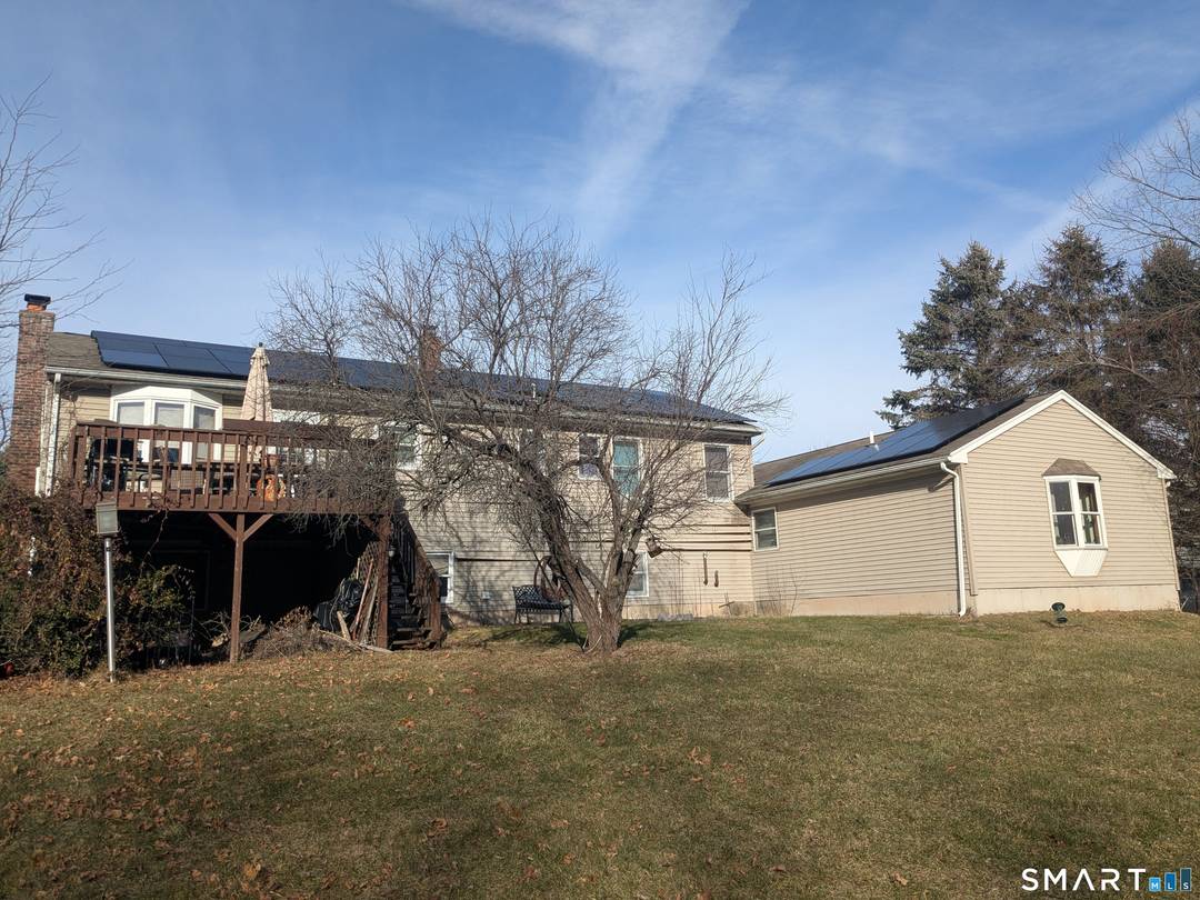 Oversized raised ranch with separated in law apartment.