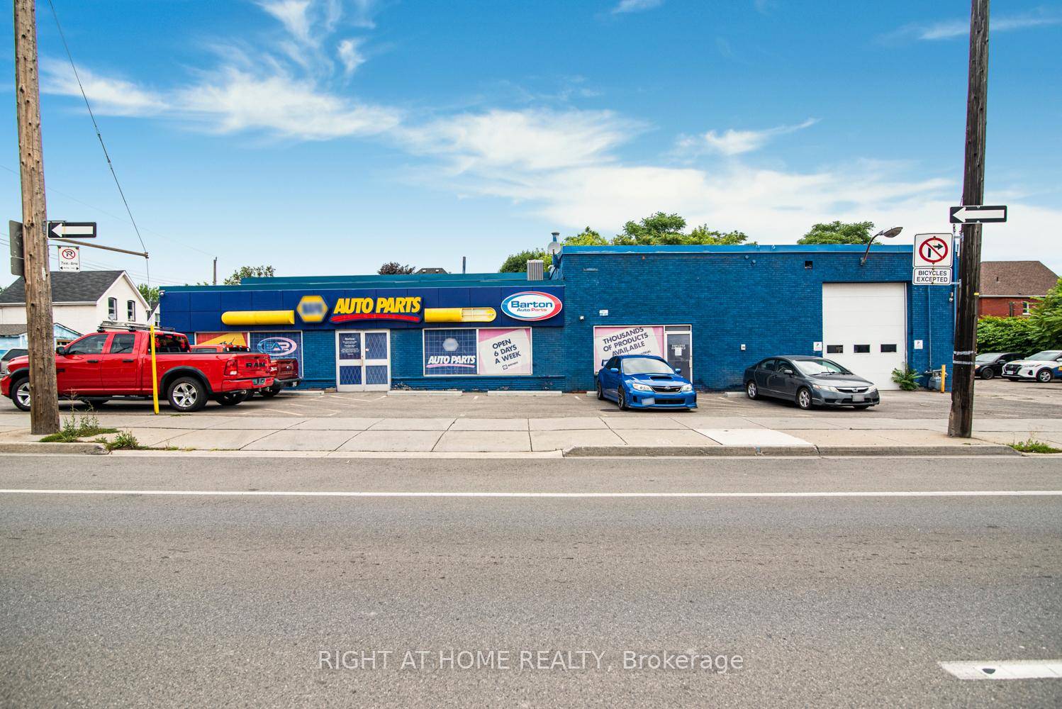 Prime Commercial Building with Additional Parking Lot For Lease in Downtown Hamilton with Drive in bay and office space.