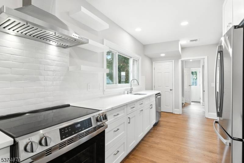 Freshly renovated, with thoughtful upgrades throughout, including a new cook's kitchen with quartz counters and stainless appliances ; central air conditioning ; new carpet, paint and refinished hardwoods.