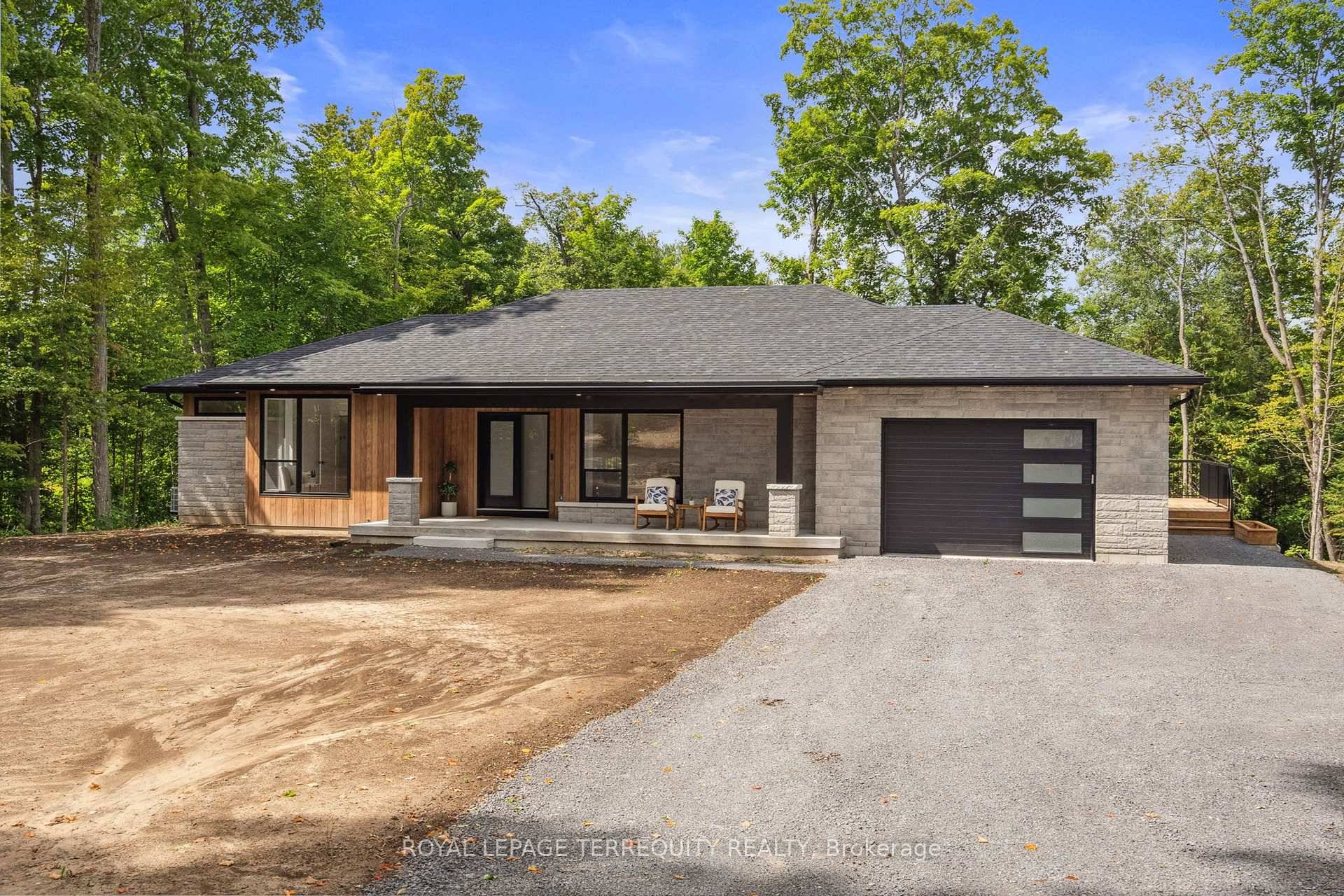 Welcome to this exceptional, newly custom built bungalow located in Warkworth, nestled on a2 acre lot that exemplifies the ultimate in design and craftsmanship.