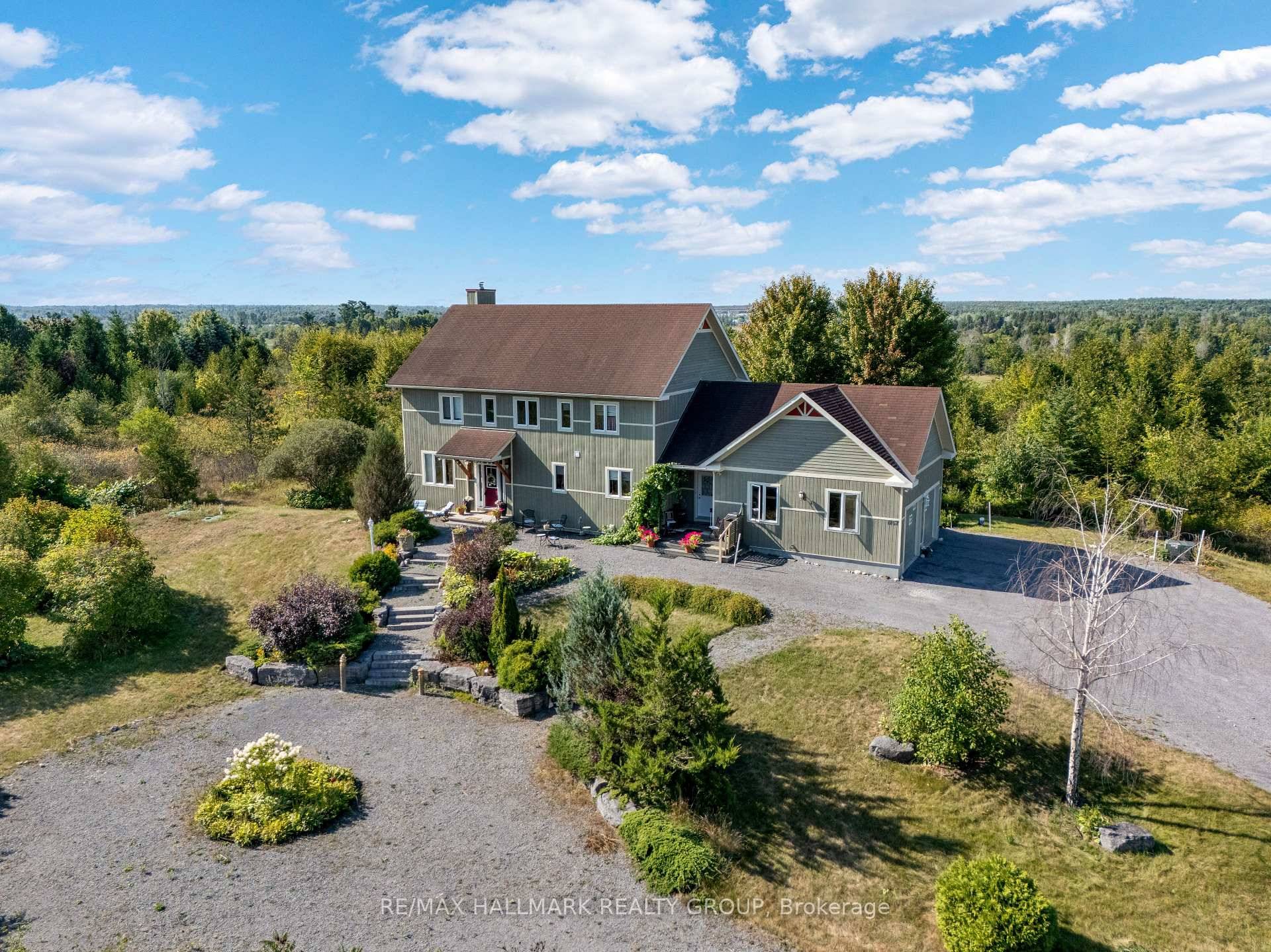 The feeling of serenity begins the moment you turn onto the driveway, with nature surrounding you on both sides all the way up to where the home is perched at ...