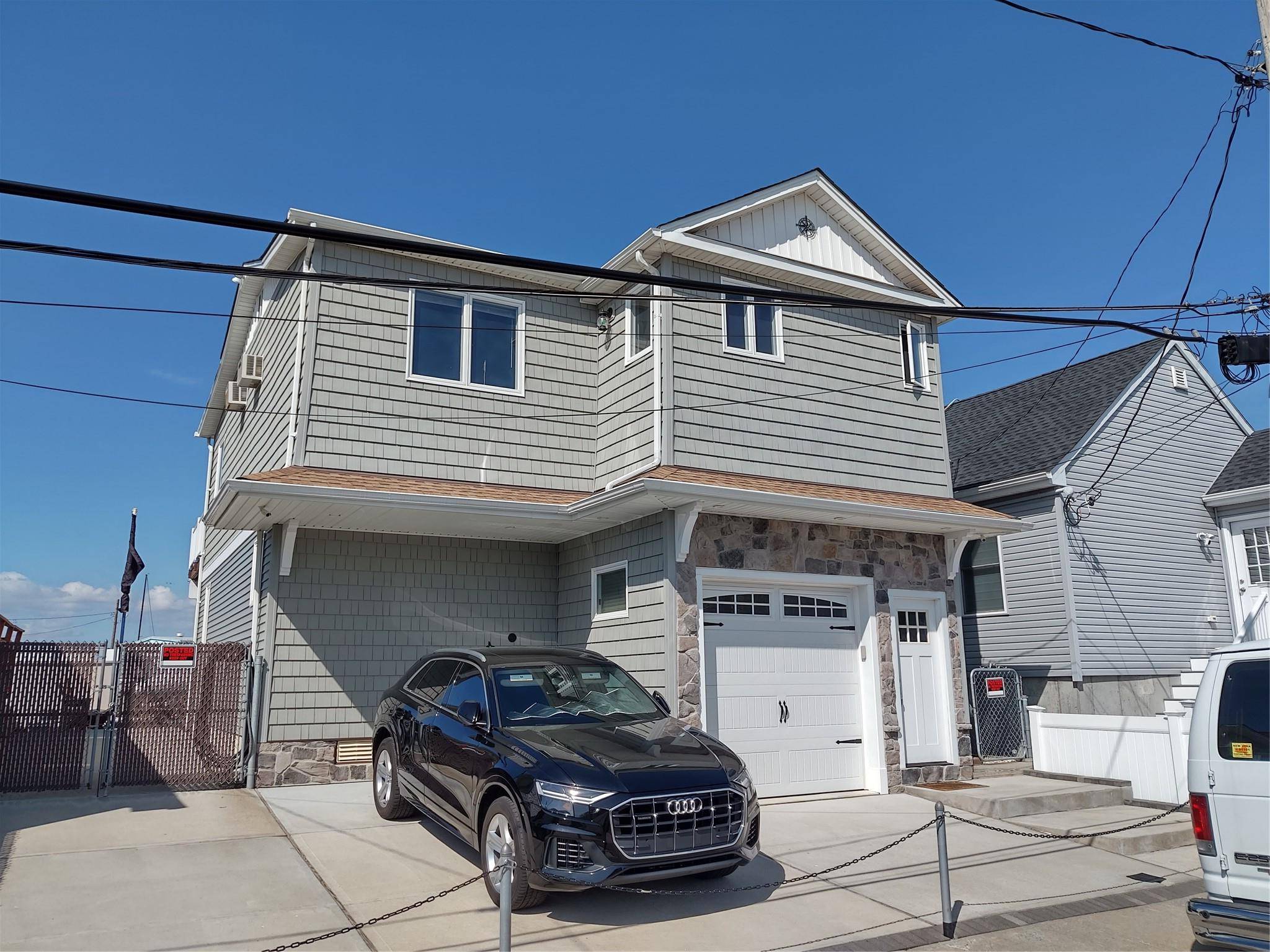 This waterfront 2 bedroom 1 bath home is located in charming East Rockaway Village.