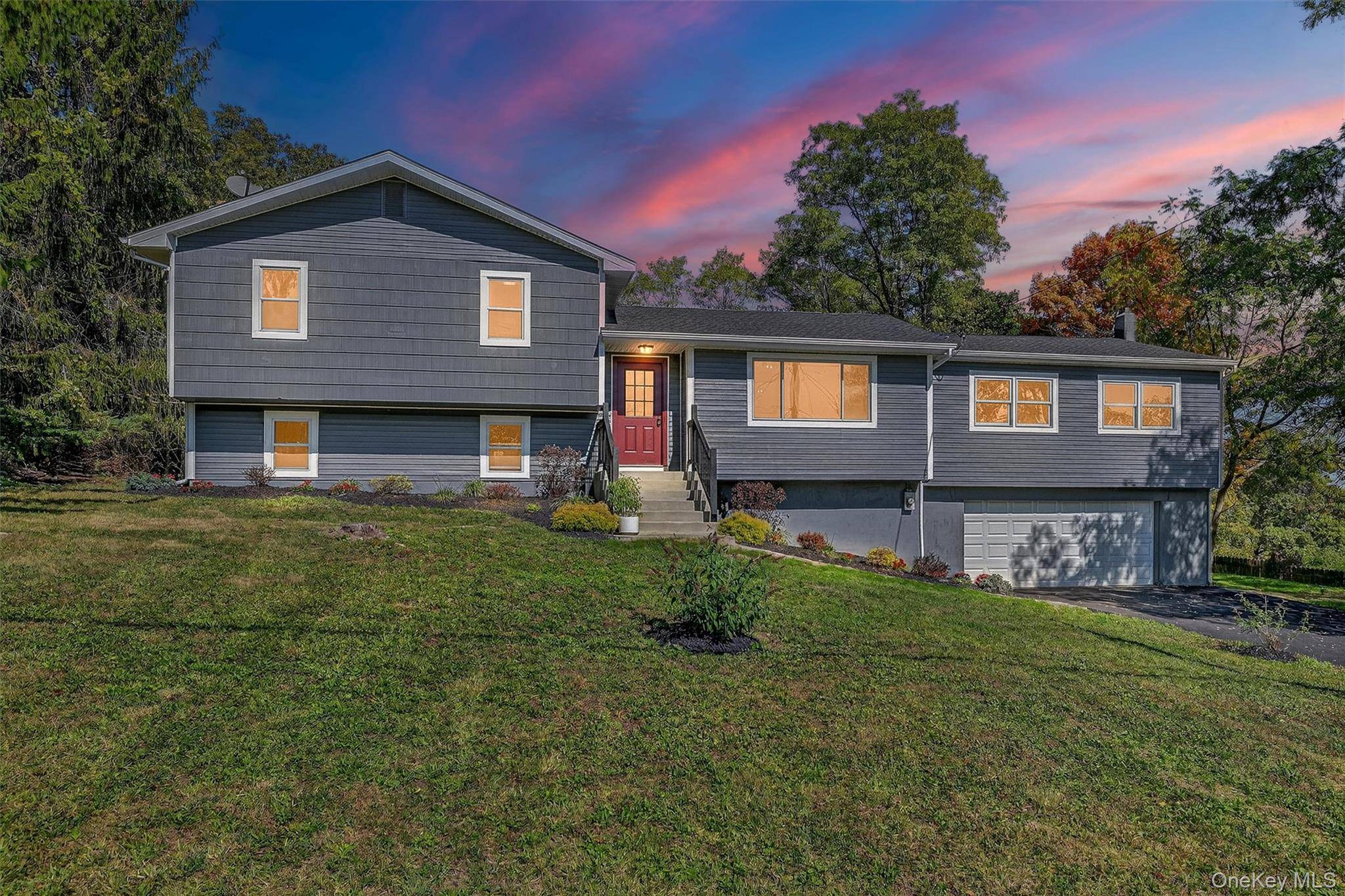 Stunning 4 Bedroom Split Level style home with gorgeous curb appeal immediately drawing your attention !