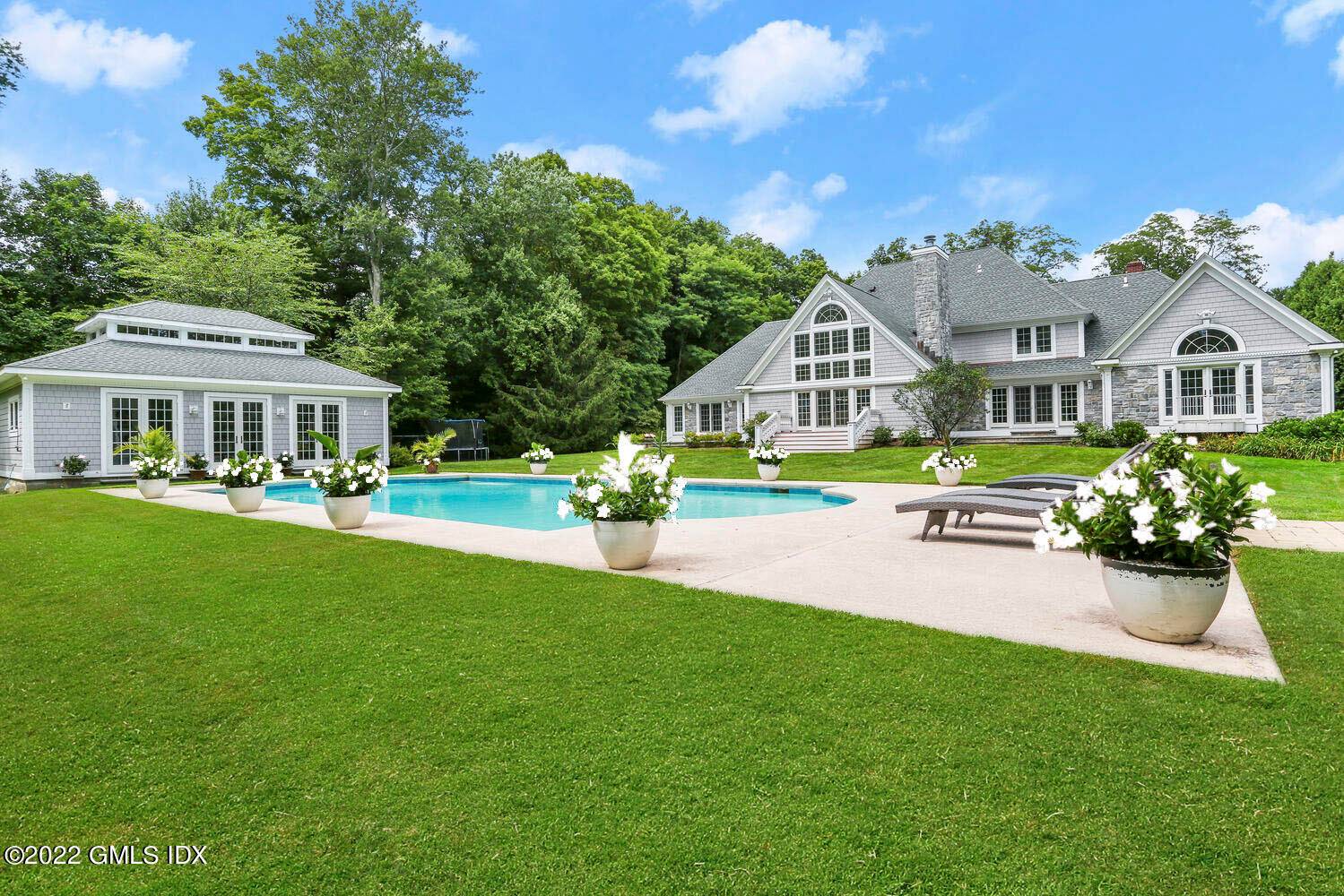 Spectacular estate sited on four, level, landscaped acres.