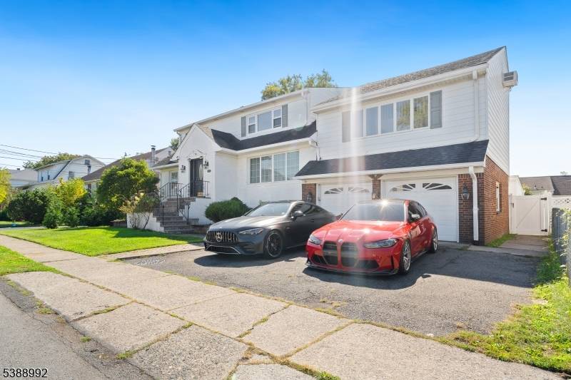 Welcome to this beautifully renovated and spacious two family home, blending modern finishes with classic charm.