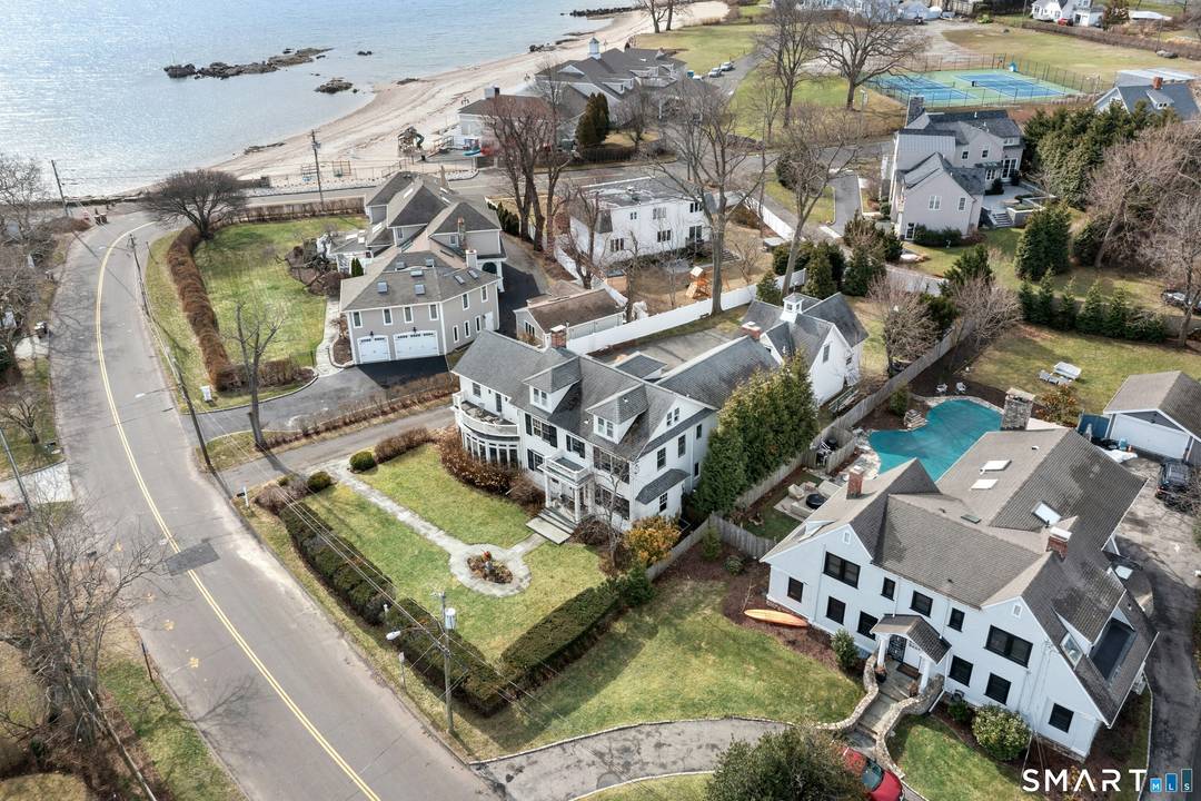 Welcome to this stately colonial, one of only 19 homes with deeded rights to the coveted Sea Beach Association on Shippan Point.