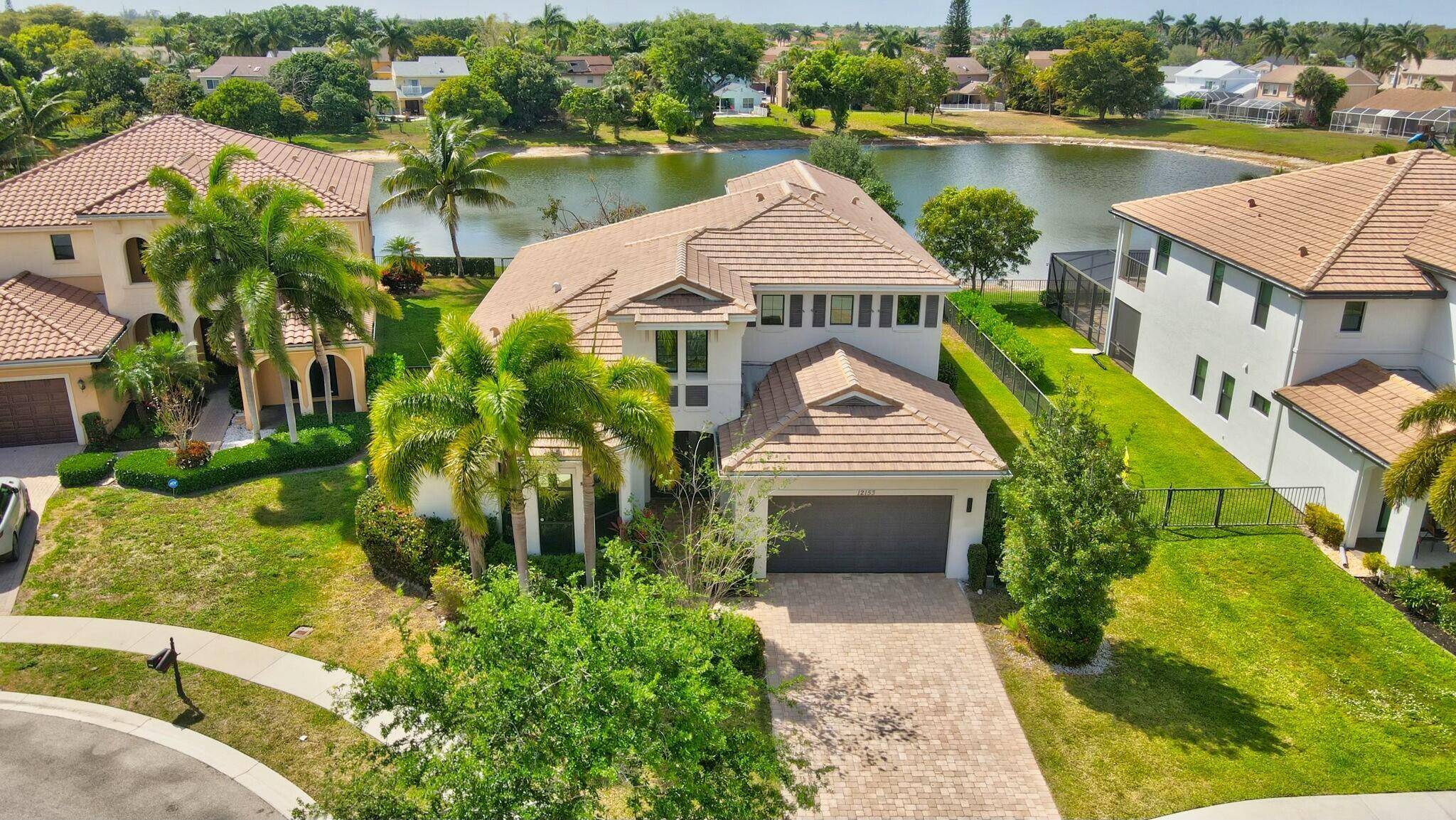 Discover the ultimate waterfront luxury at 12153 Boca Reserve Lane !