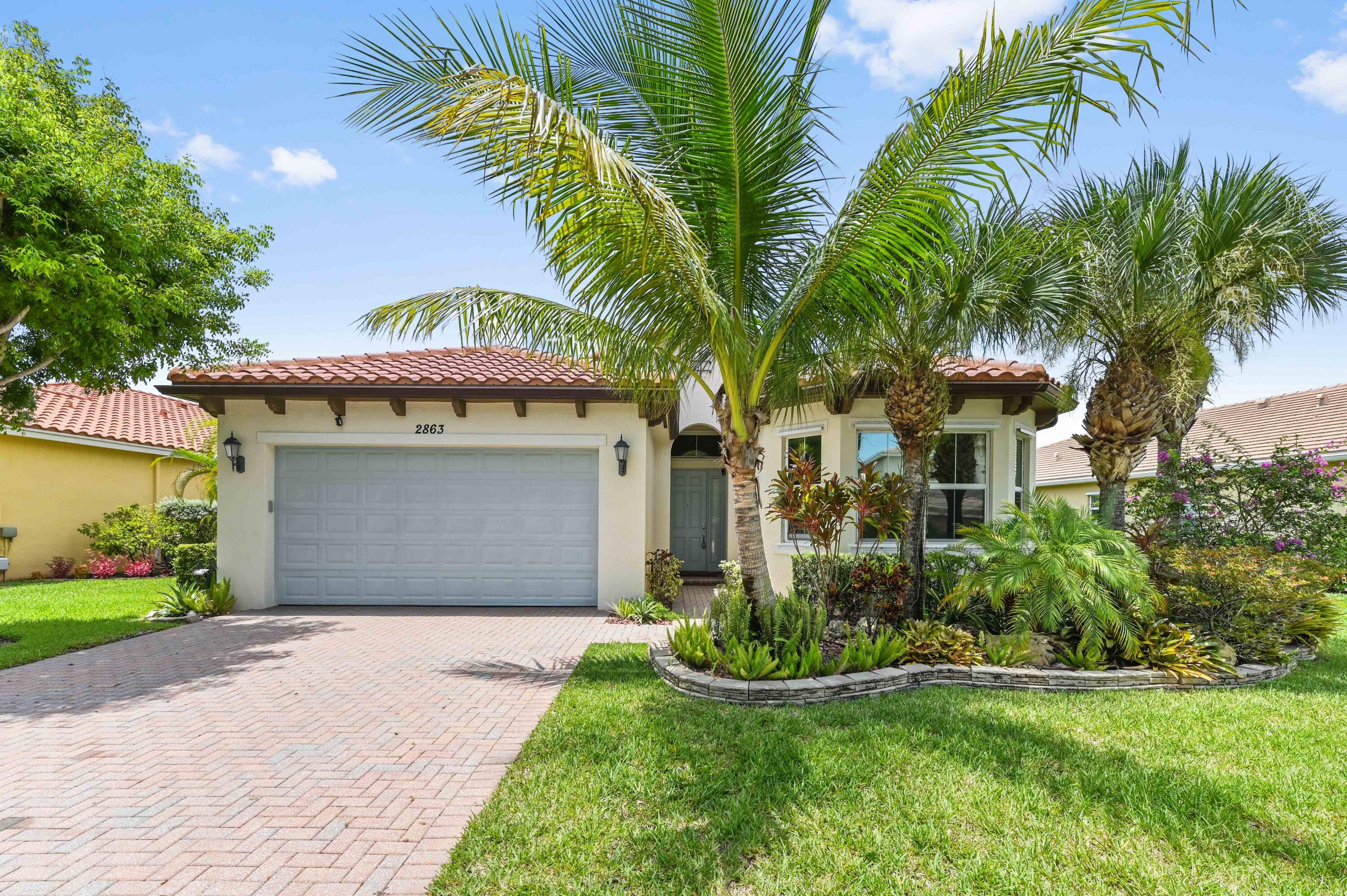 Stunning lakefront gem with a privately fenced yard and oversized screened lanai with picture perfect water views, boasting 4 beds and 2.