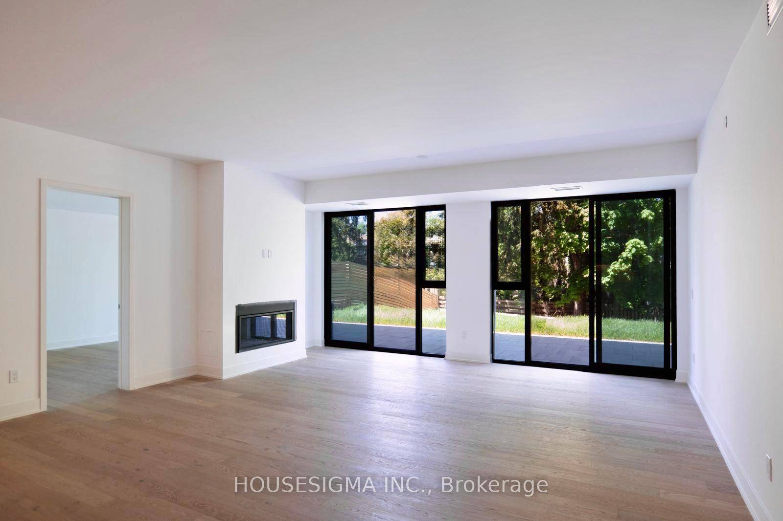 Luxury new condo living with a PRIVATE BACKYARD and a terrace.