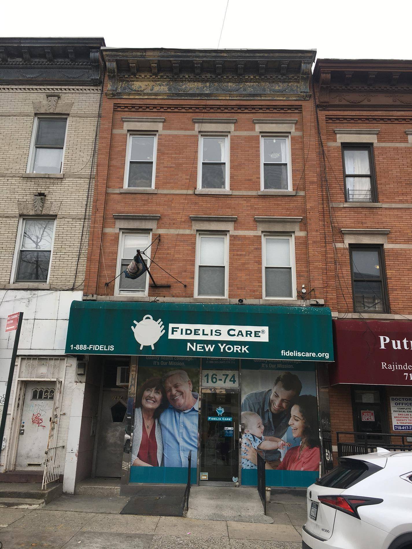 Four family brick mix use property with commercial store.