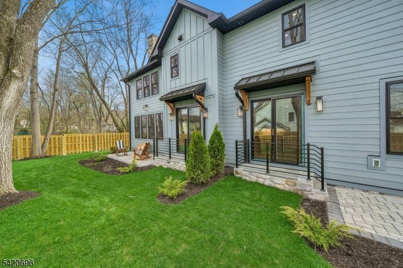 Welcome to Central Villas, a refined end unit townhome in the heart of New Providence, a seamless blend of modern design effortless living.