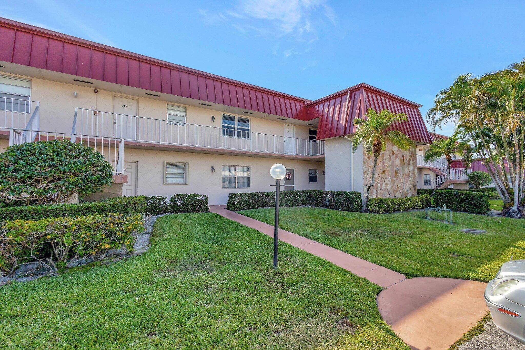 Don't miss this Royal Palm Beach Retreat in 55 Greenway Village.