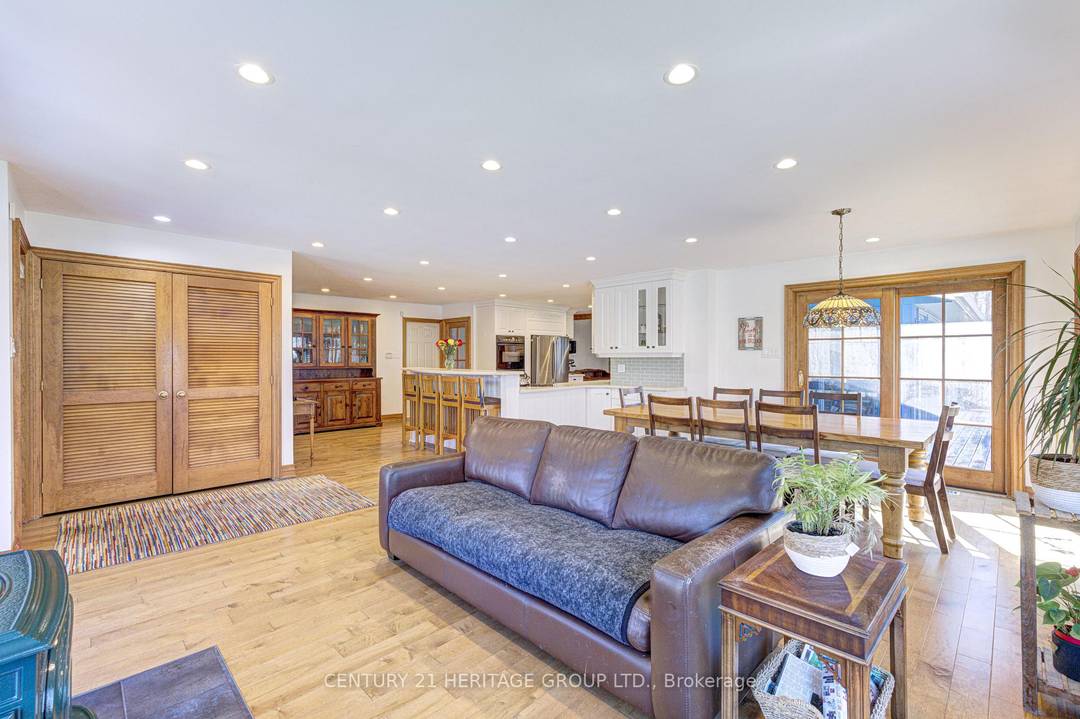 Nestled on a sprawling 5 acre lot with approximately 500 feet of frontage, this well maintained 4 bedroom bungalow offers both charm and practicality.